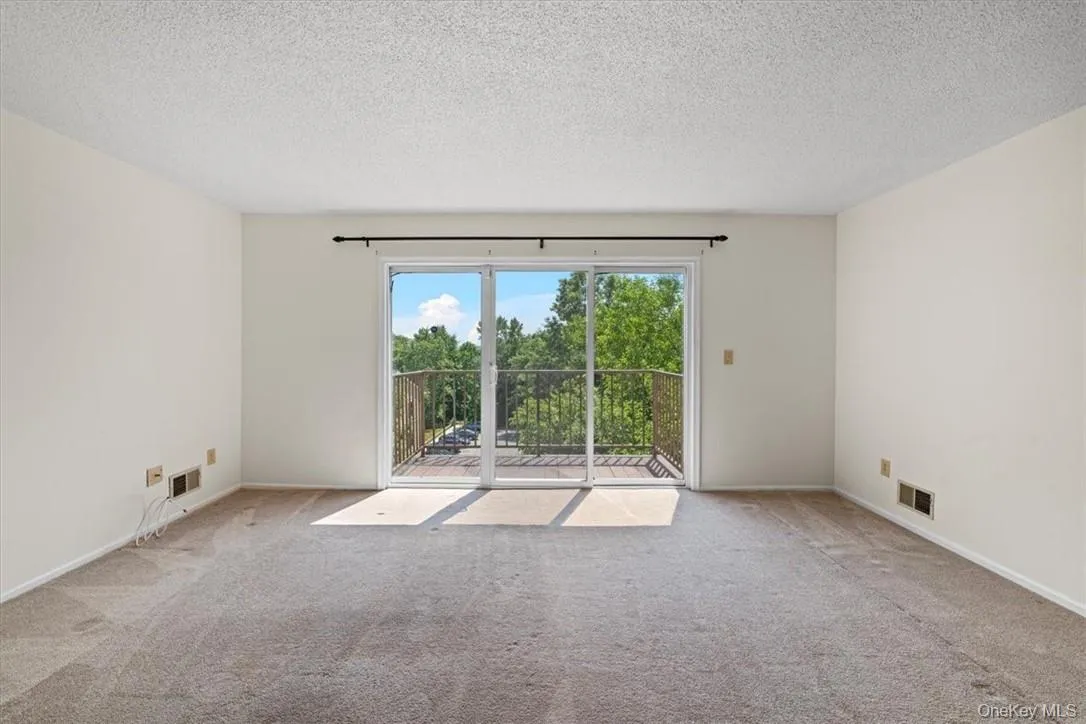 Living Room w/ SGD to Deck / Dining Area Living Room w/ SGD to Deck / Dining Area