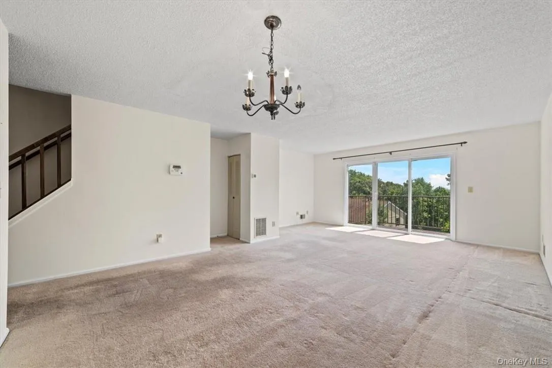 Living Room w/ SGD to Deck / Dining Area Living Room w/ SGD to Deck / Dining Area