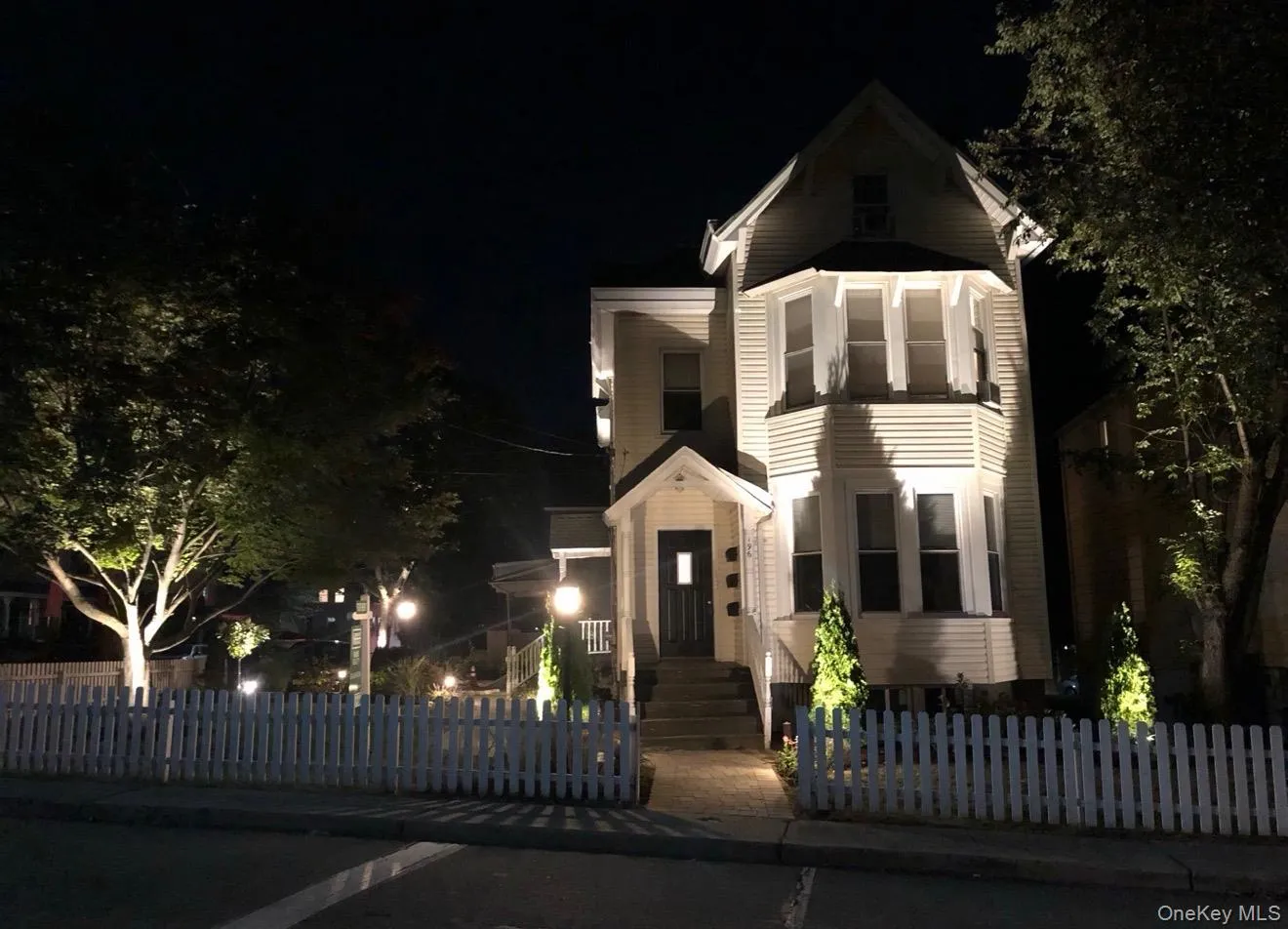 View of front of home featuring a fenced front yard View of front of home featuring a fenced front yard