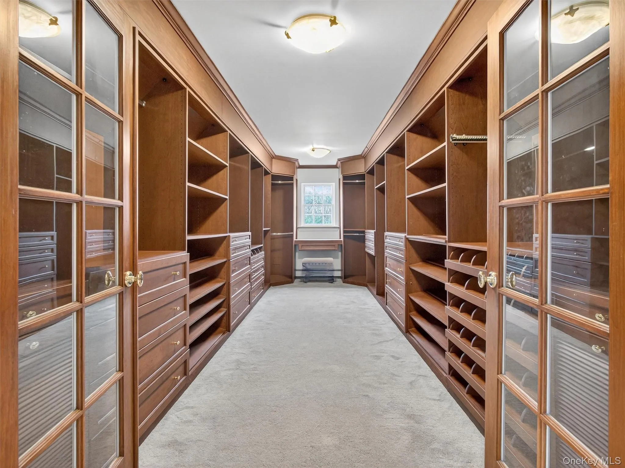 Spacious closet featuring light colored carpet Spacious closet featuring light colored carpet