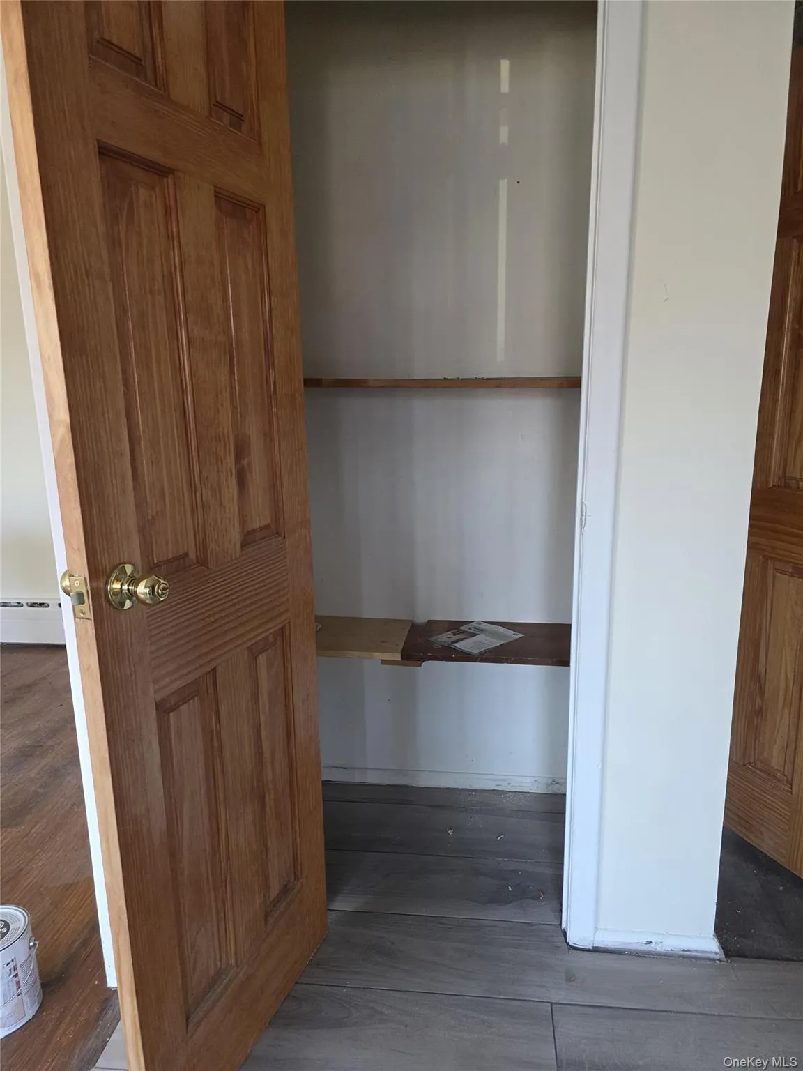 Closet featuring a baseboard radiator Closet featuring a baseboard radiator
