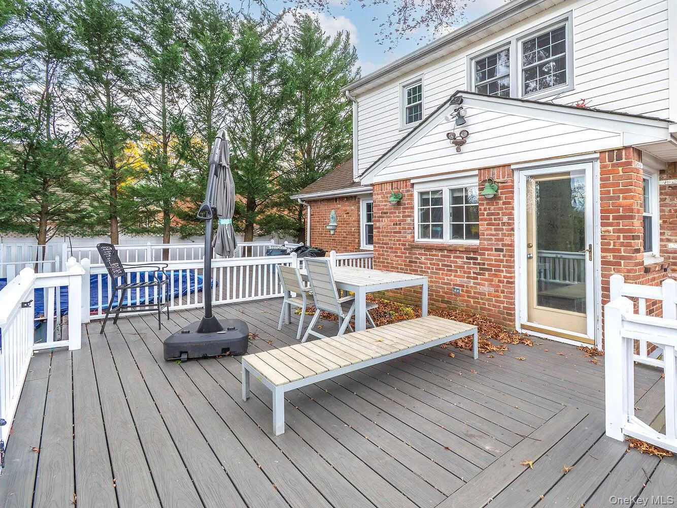 Deck with outdoor dining area and a fenced backyard Deck with outdoor dining area and a fenced backyard