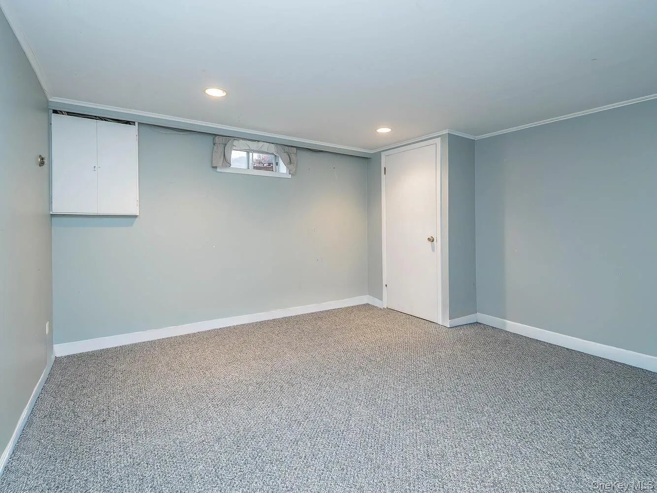 Below grade area featuring recessed lighting, light carpet, and crown molding Below grade area featuring recessed lighting, light carpet, and crown molding