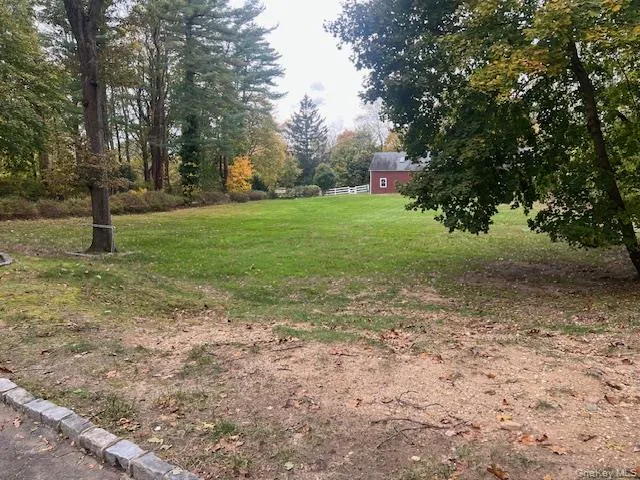 View of grassy yard featuring view of scattered trees View of grassy yard featuring view of scattered trees