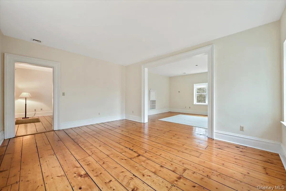 Empty room with light wood finished floors Empty room with light wood finished floors