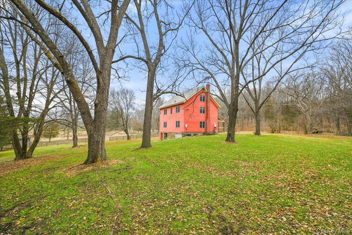 View of yard featuring a barn View of yard featuring a barn