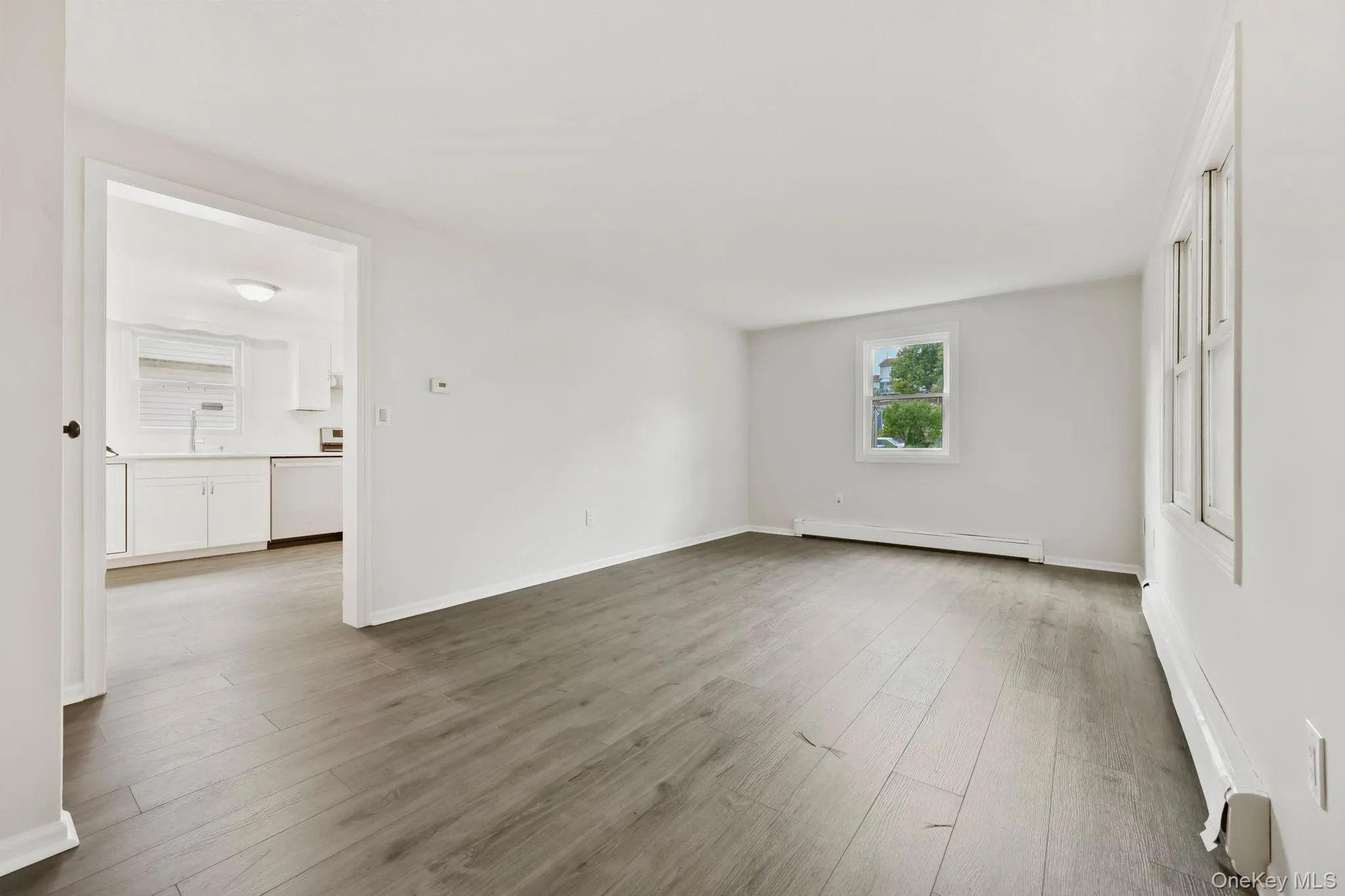Unfurnished living room with hardwood floors Unfurnished living room with hardwood floors