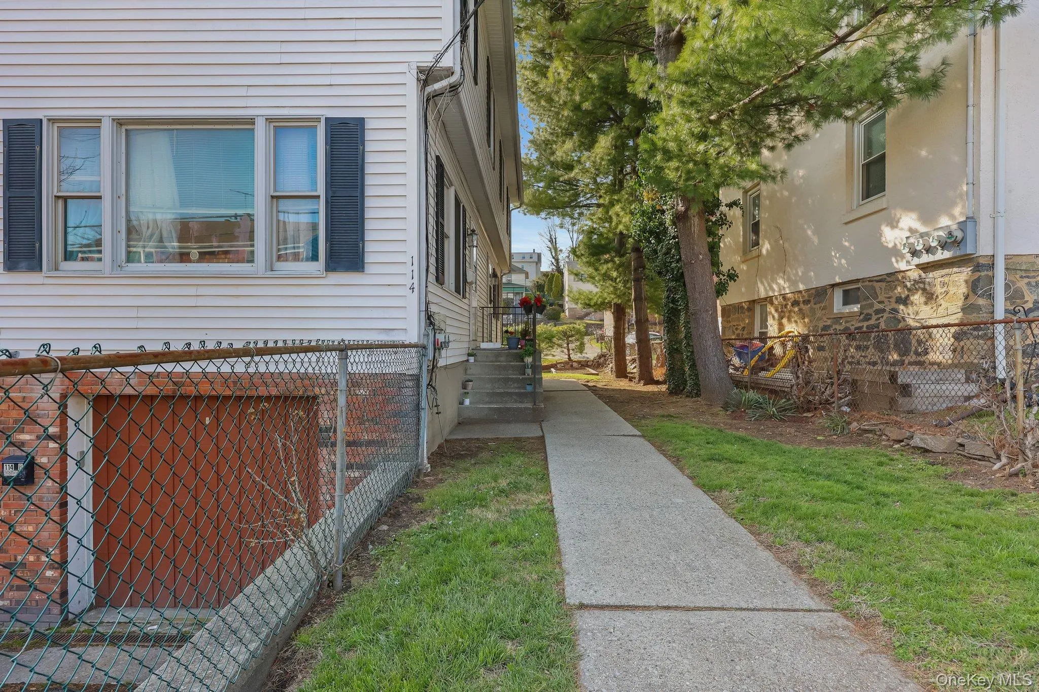 View of property exterior featuring fence View of property exterior featuring fence