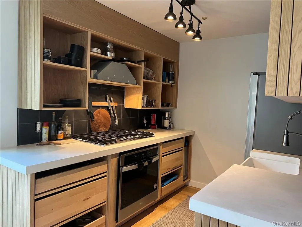 Completely modern kitchen. There are a few final touches yet to be completed (like the cabinet over the range) but rest-assured anything left unfinished will be completed upon lease signing. Completely modern kitchen. There are a few final touches yet to be completed (like the cabinet over the range) but rest-assured anything left unfinished will be completed upon lease signing.