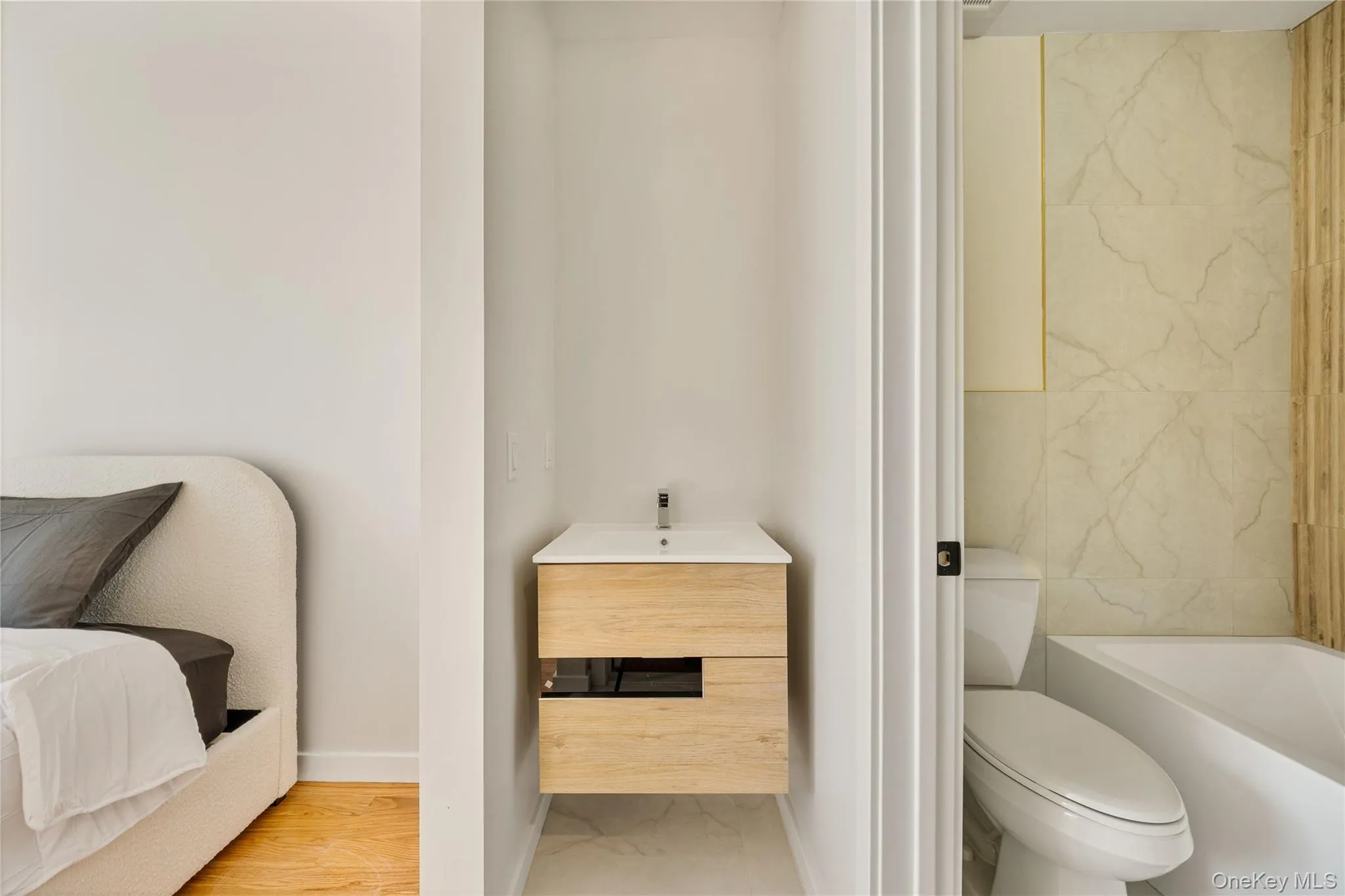 Bathroom with vanity and baseboards Bathroom with vanity and baseboards