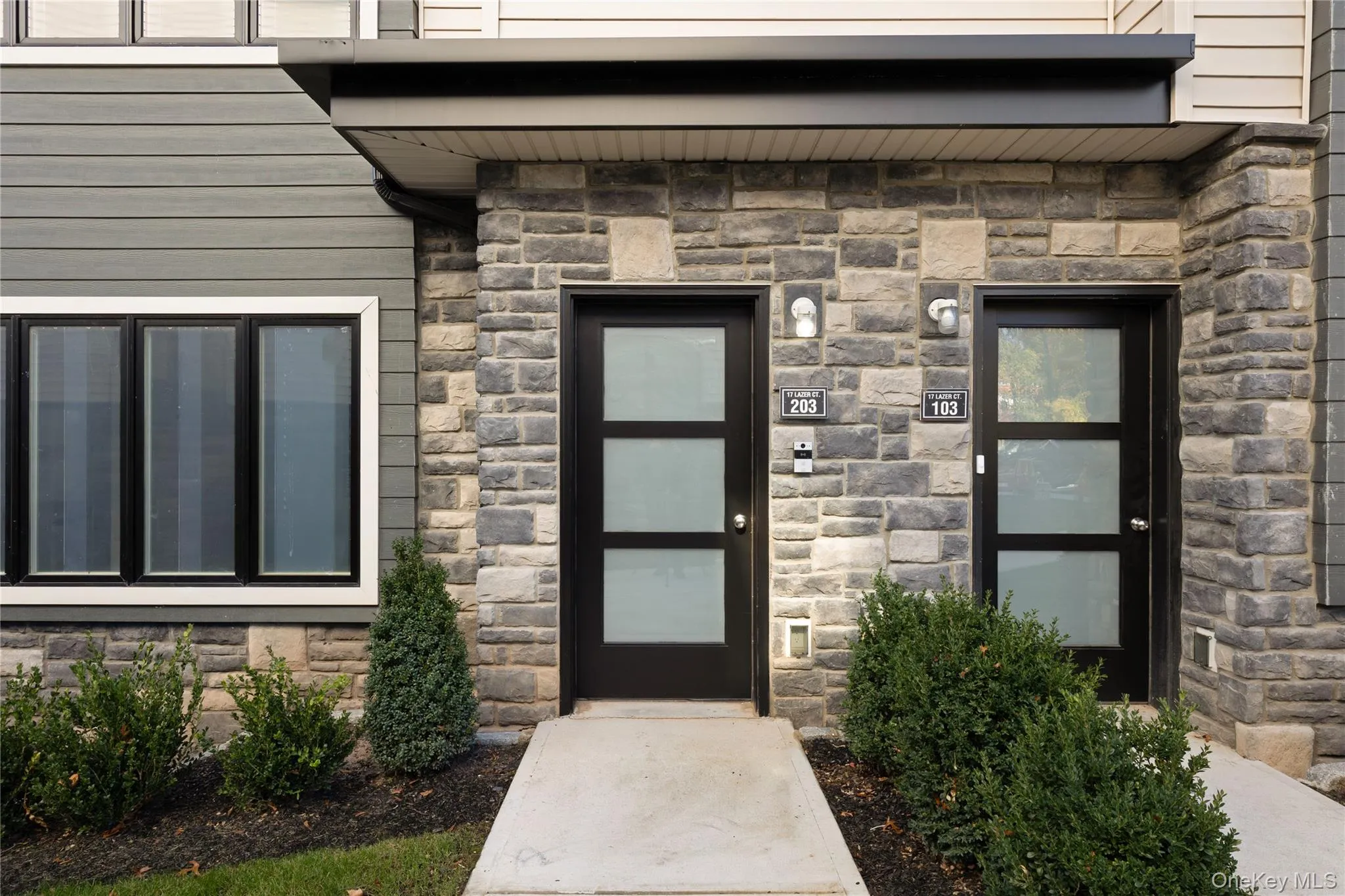 Property entrance featuring stone siding Property entrance featuring stone siding