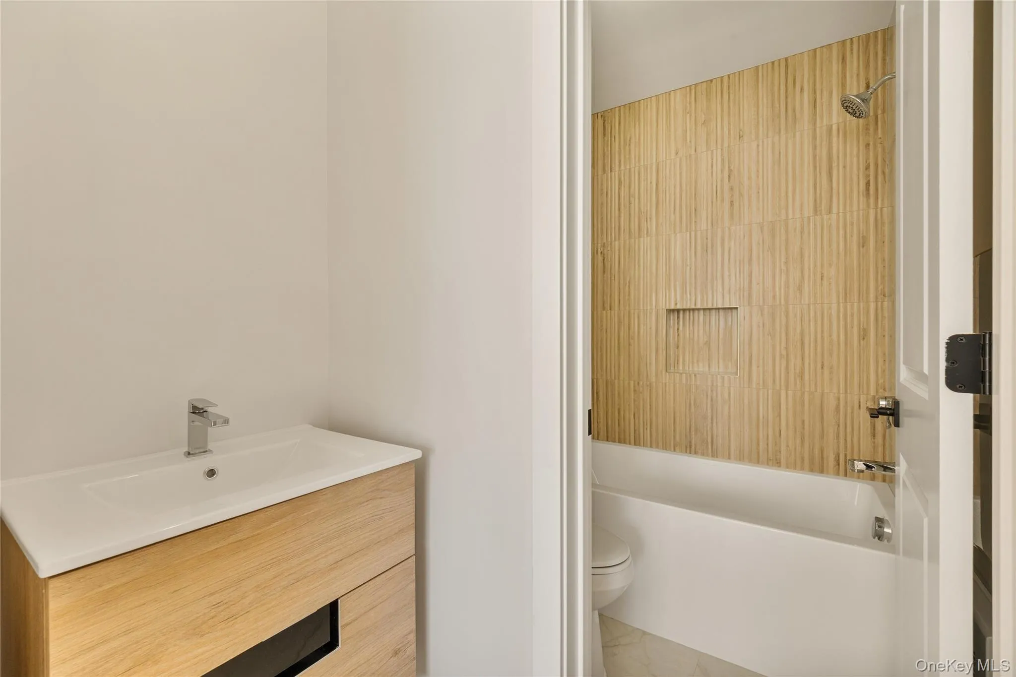Full bath featuring vanity and tub / shower combination Full bath featuring vanity and tub / shower combination