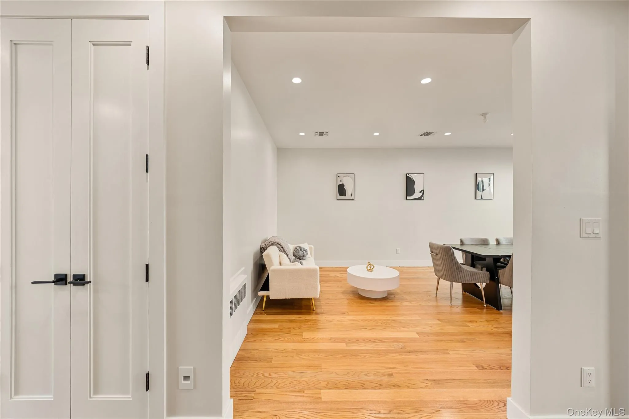 Sitting room with recessed lighting and light wood-type flooring Sitting room with recessed lighting and light wood-type flooring