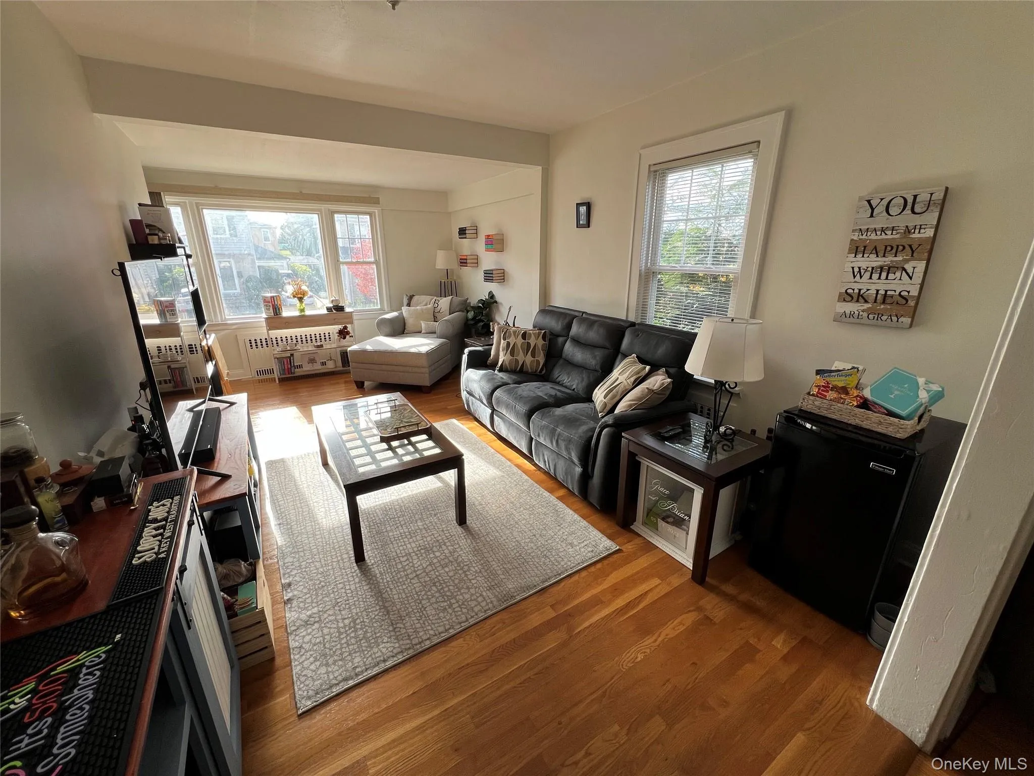 Living area with wood finished floors Living area with wood finished floors