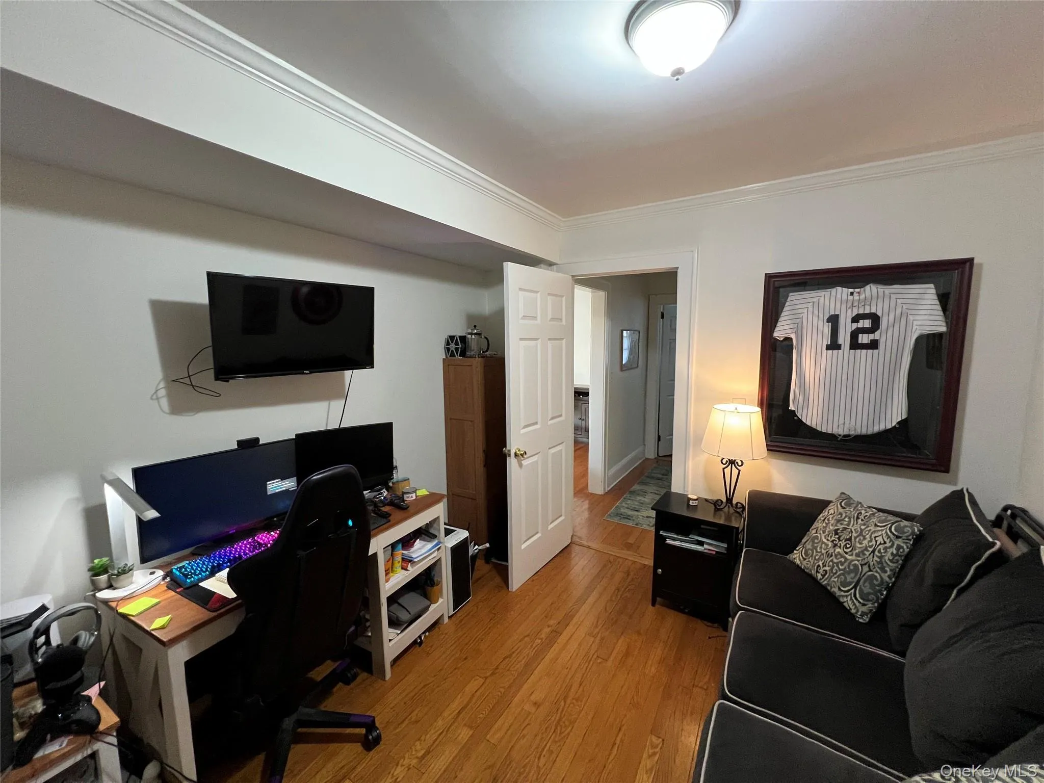 Office featuring crown molding and wood finished floors Office featuring crown molding and wood finished floors