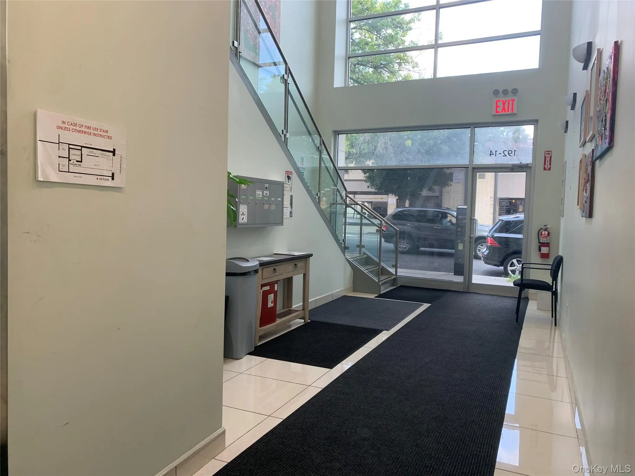 Community lobby with a towering ceiling and stairway Community lobby with a towering ceiling and stairway