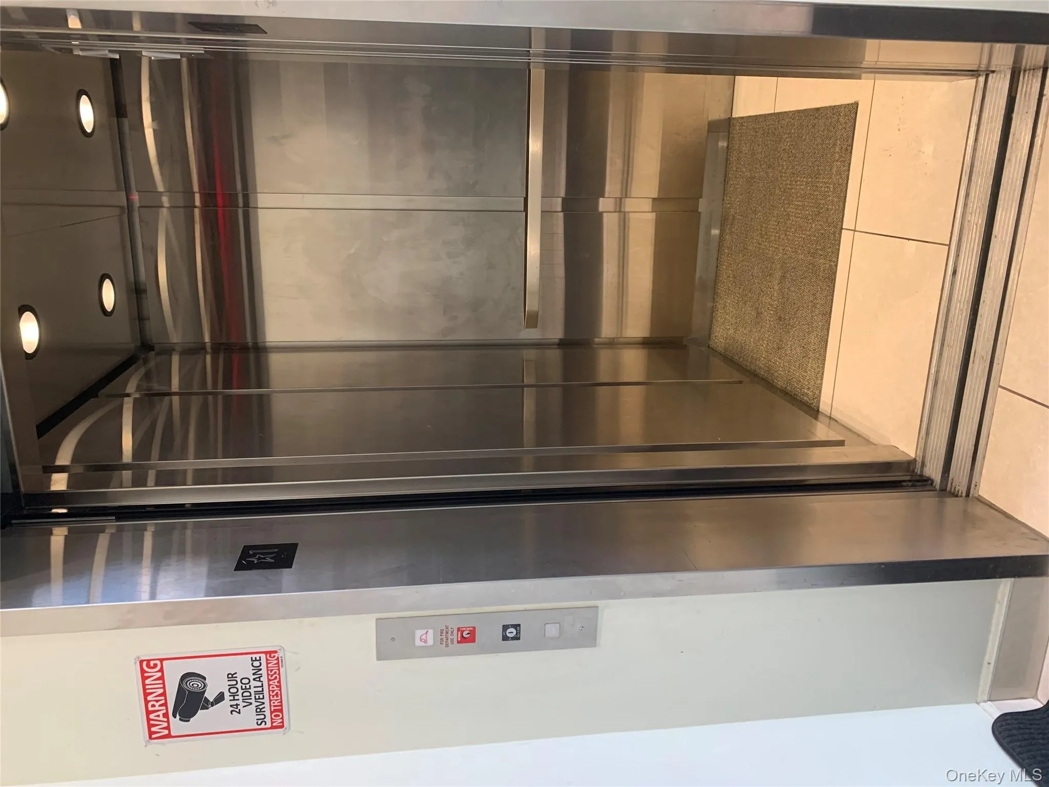 Elevator featuring baseboards and recessed lighting Elevator featuring baseboards and recessed lighting