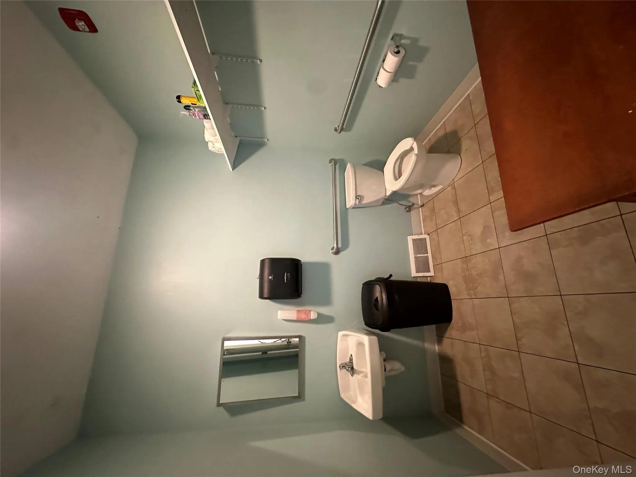 Half bath with light tile patterned flooring and baseboards Half bath with light tile patterned flooring and baseboards