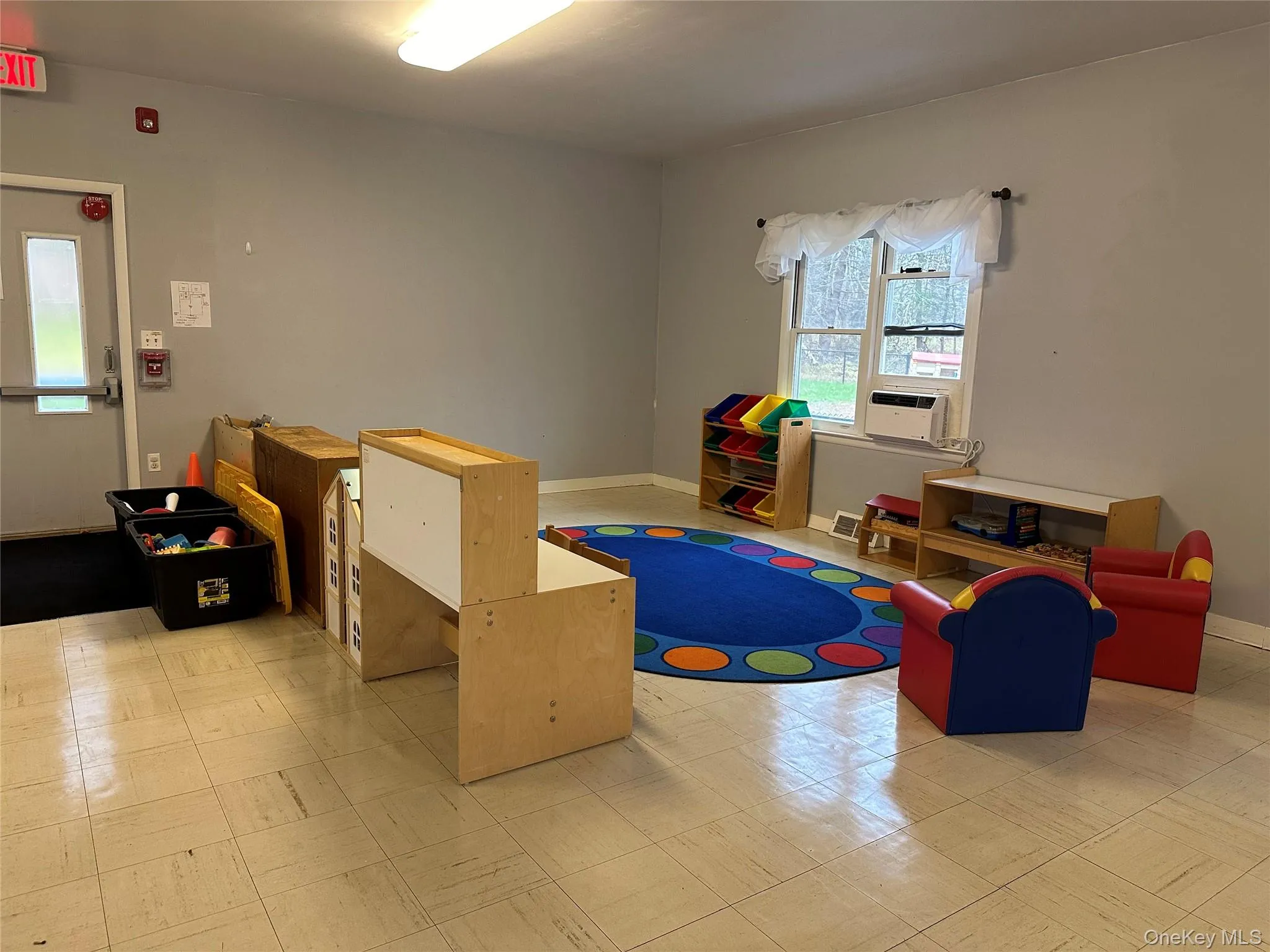 Game room with cooling unit Game room with cooling unit