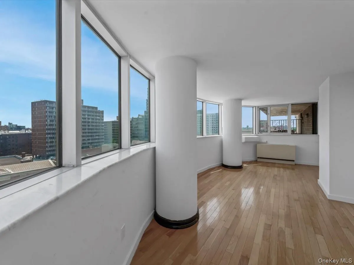 Corridor with light wood finished floors and a city view Corridor with light wood finished floors and a city view