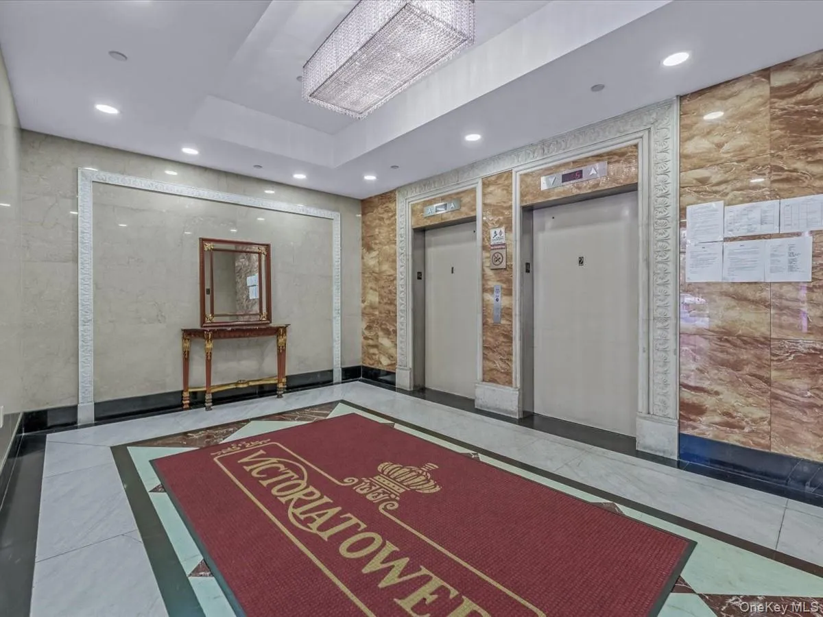 Community lobby with recessed lighting and tile walls Community lobby with recessed lighting and tile walls