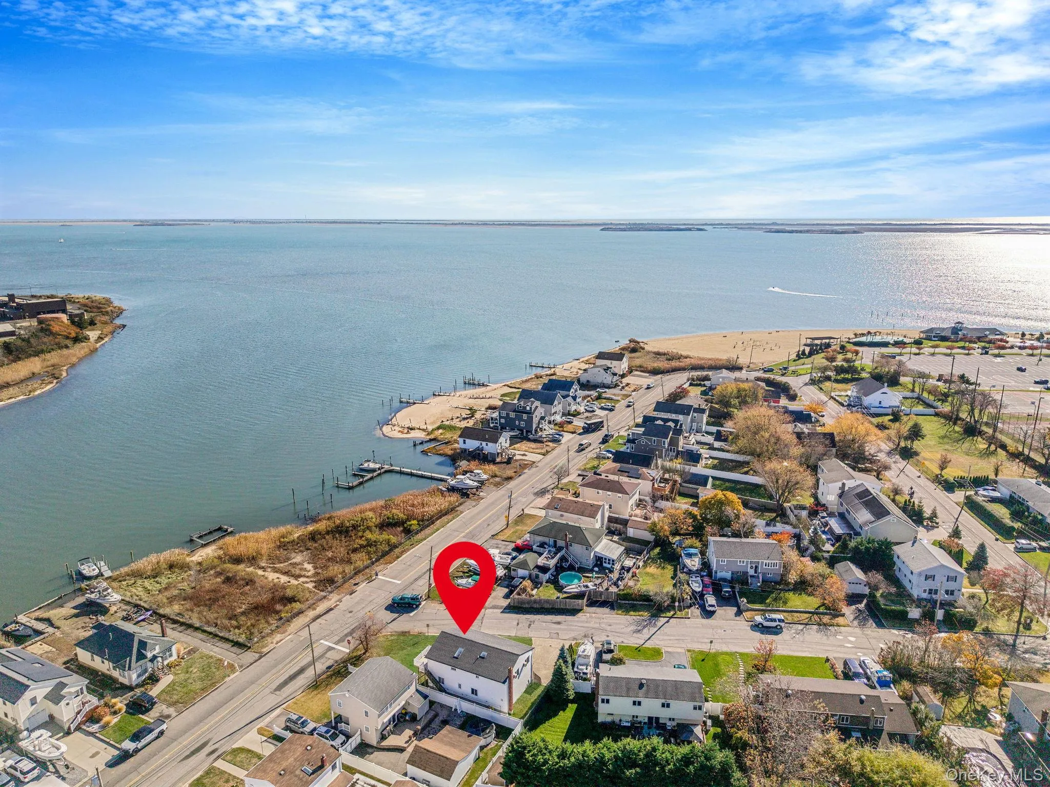 View of property location with nearby suburban area and a large body of water View of property location with nearby suburban area and a large body of water