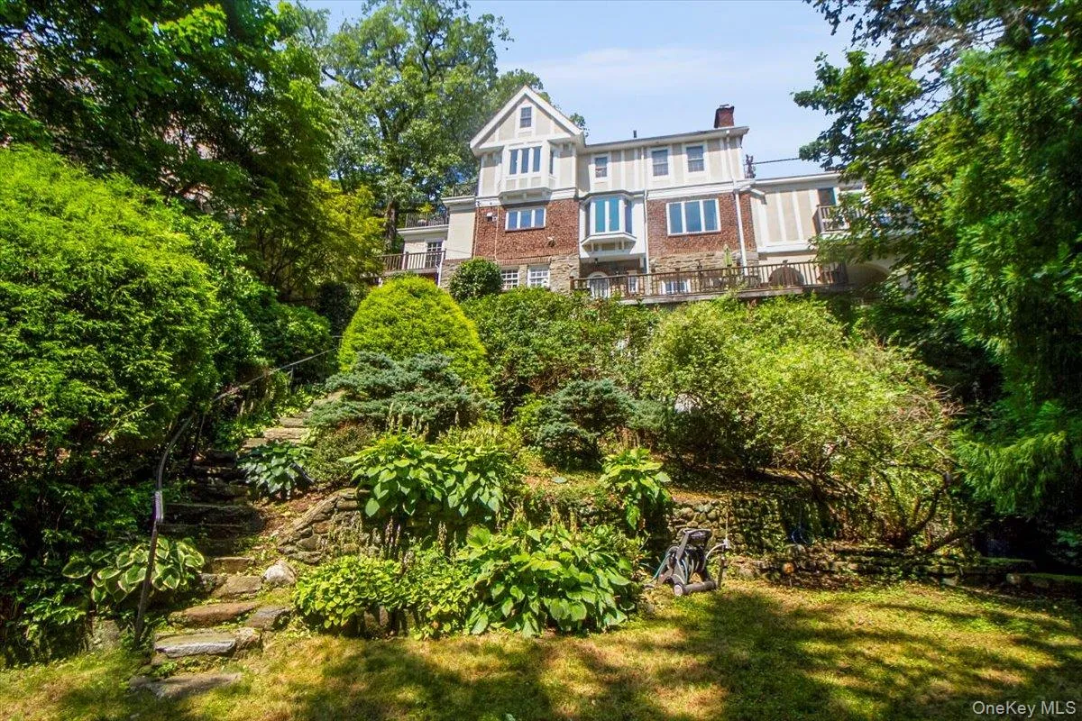 Back of house with yard Back of house with yard