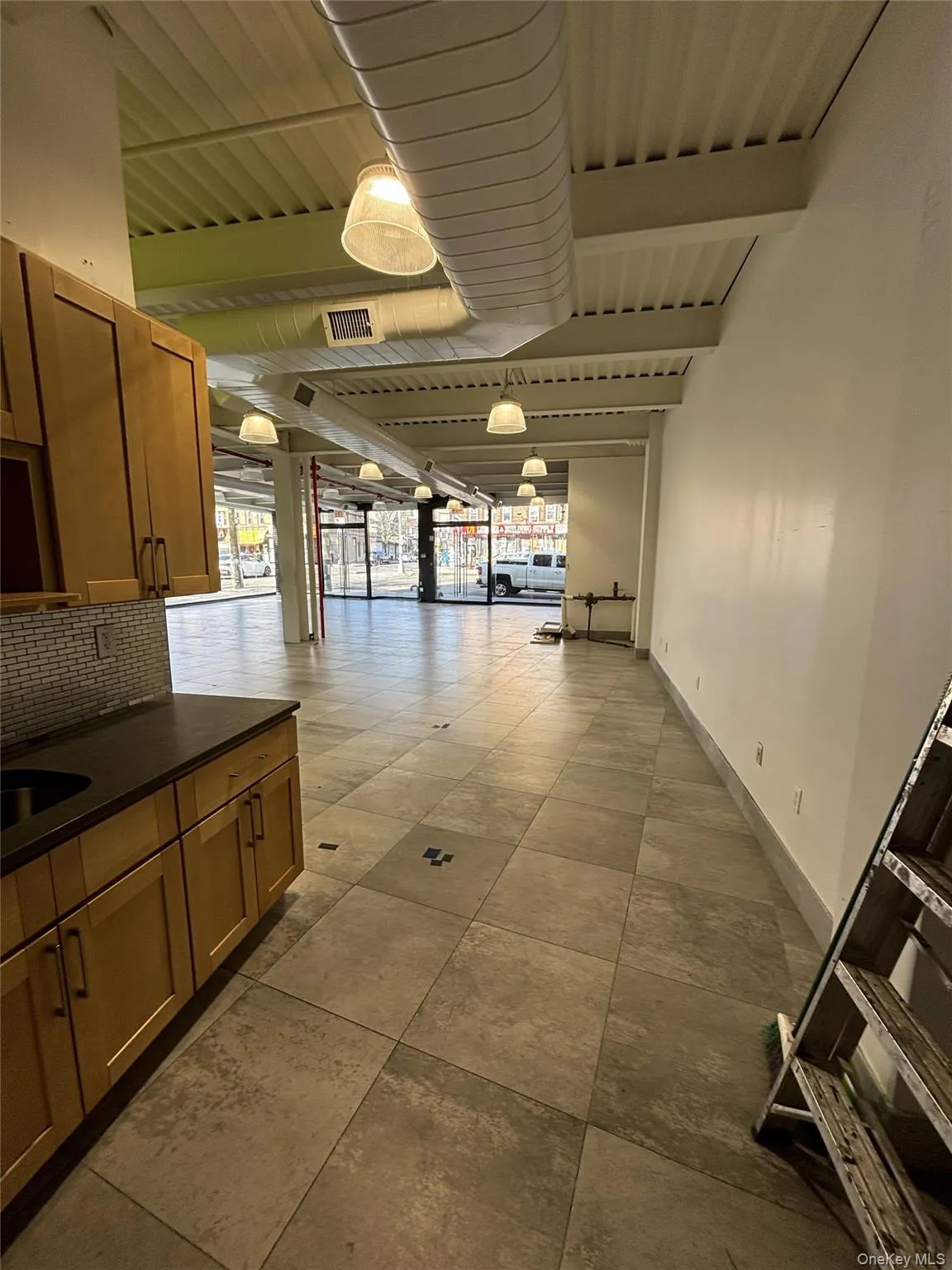Corridor with beamed ceiling and baseboards Corridor with beamed ceiling and baseboards