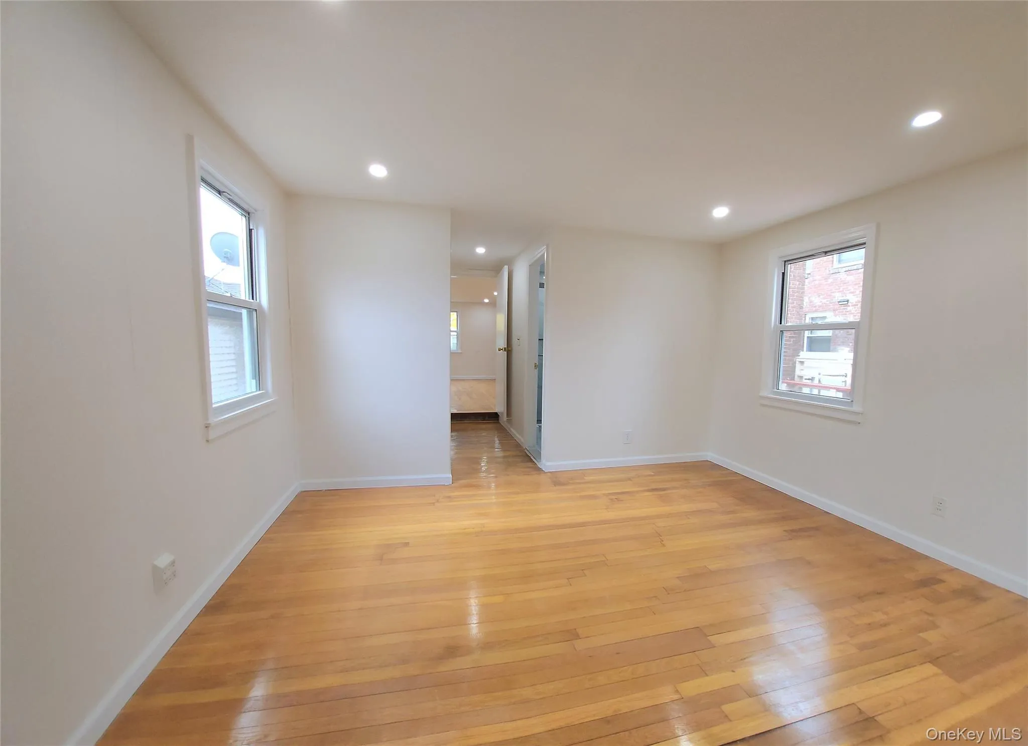 Spare room with light wood-style flooring and recessed lighting Spare room with light wood-style flooring and recessed lighting