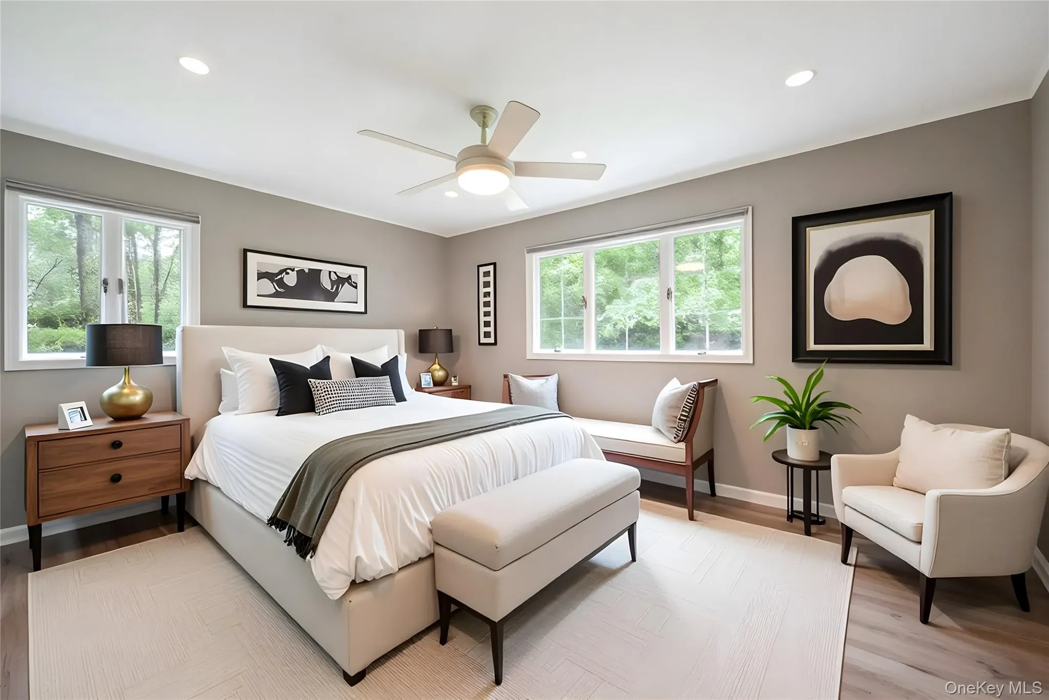 Bedroom featuring recessed lighting, wood finished floors, and a ceiling fan Bedroom featuring recessed lighting, wood finished floors, and a ceiling fan