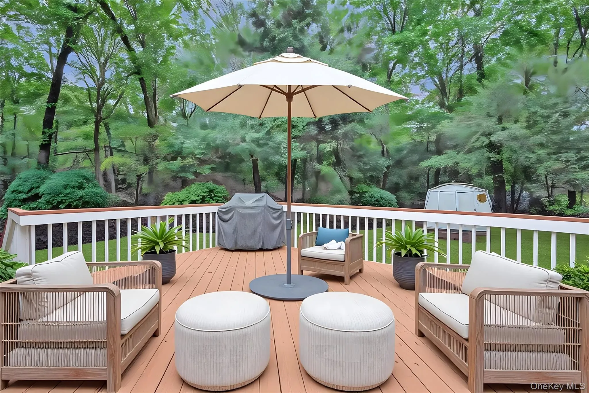 Deck featuring a storage shed, grilling area, and a lawn Deck featuring a storage shed, grilling area, and a lawn