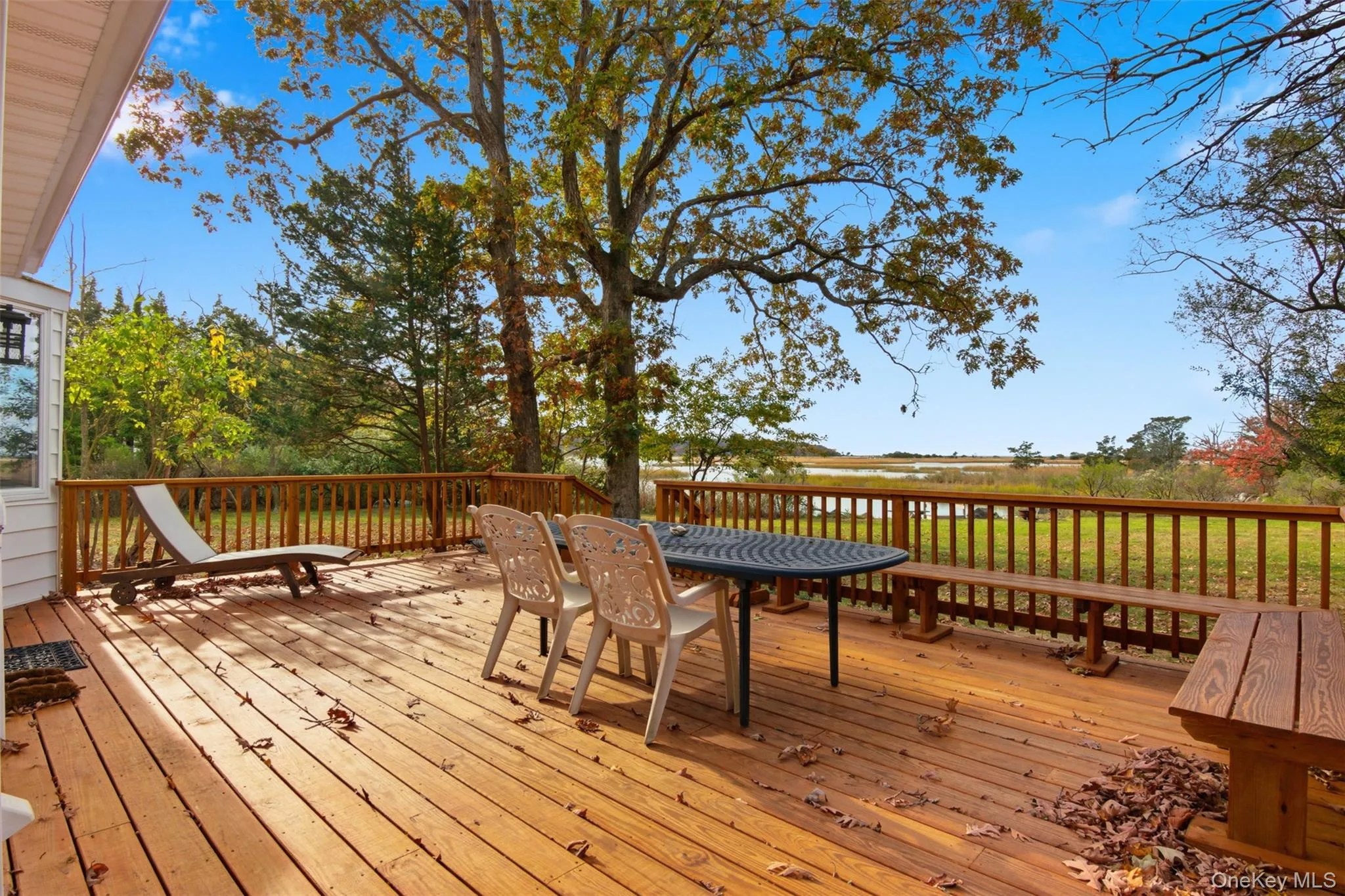 Wooden terrace featuring outdoor dining area Wooden terrace featuring outdoor dining area