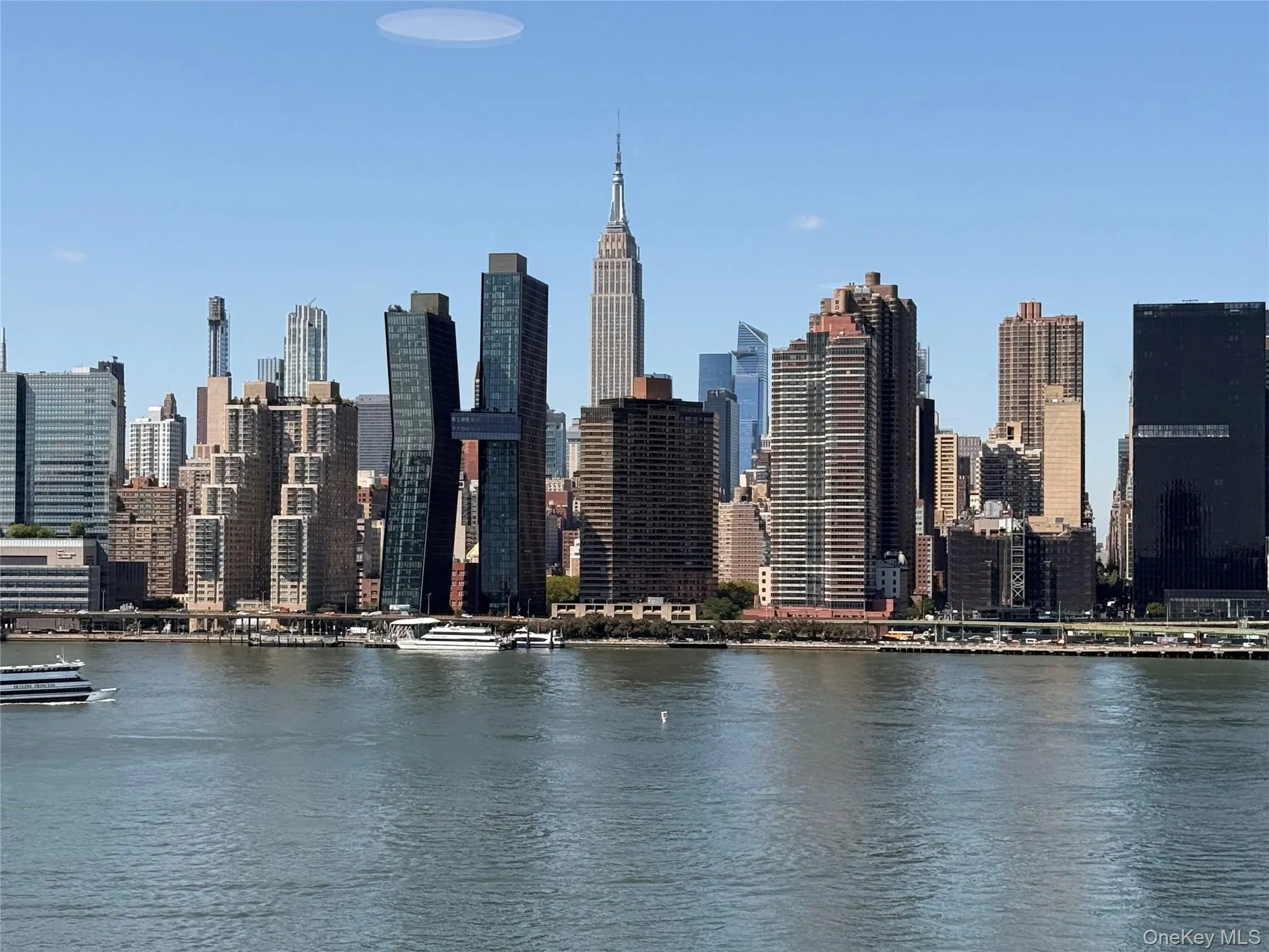 Skyline view featuring a large body of water Skyline view featuring a large body of water