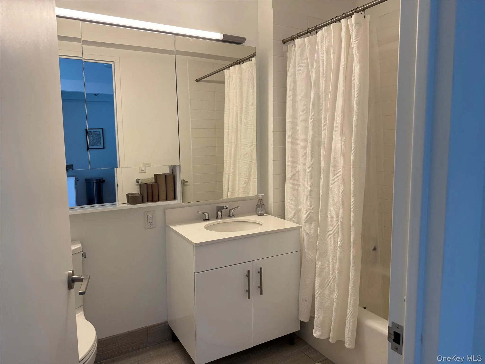 Full bathroom with vanity and shower / bath combo with shower curtain Full bathroom with vanity and shower / bath combo with shower curtain