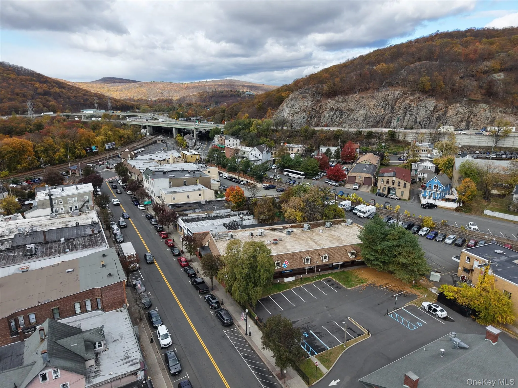 View of property location with a mountain backdrop and a notable bridge View of property location with a mountain backdrop and a notable bridge