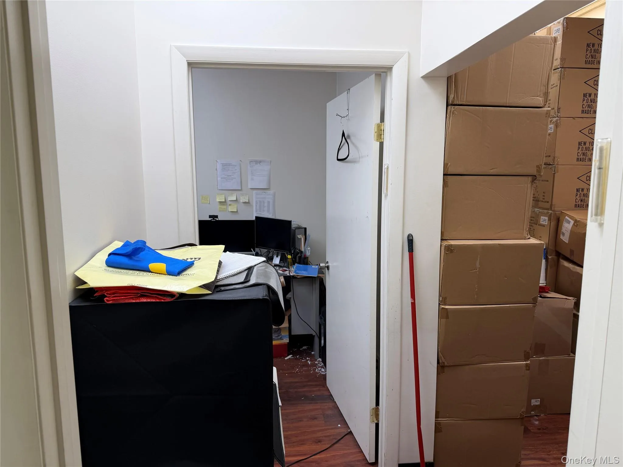 Bedroom featuring an office area and dark wood-type flooring Bedroom featuring an office area and dark wood-type flooring
