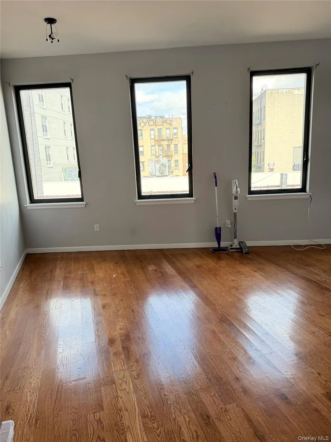 Spare room with wood finished floors Spare room with wood finished floors