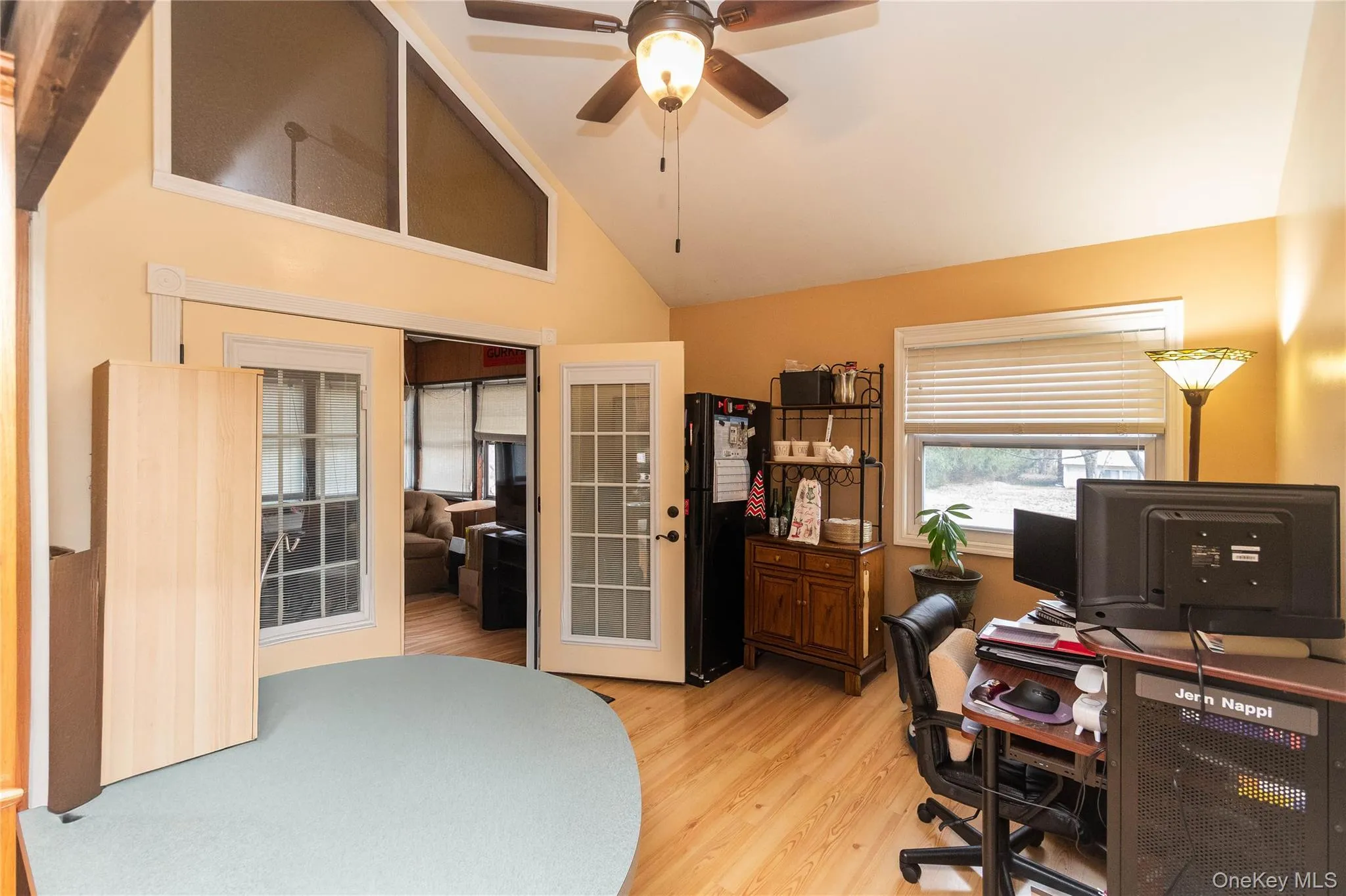 Kitchen nook or office with doors to three season room Kitchen nook or office with doors to three season room