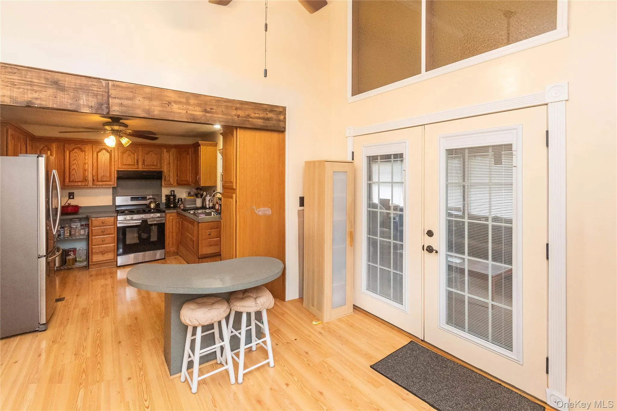 Kitchen nook with doors to three season room Kitchen nook with doors to three season room