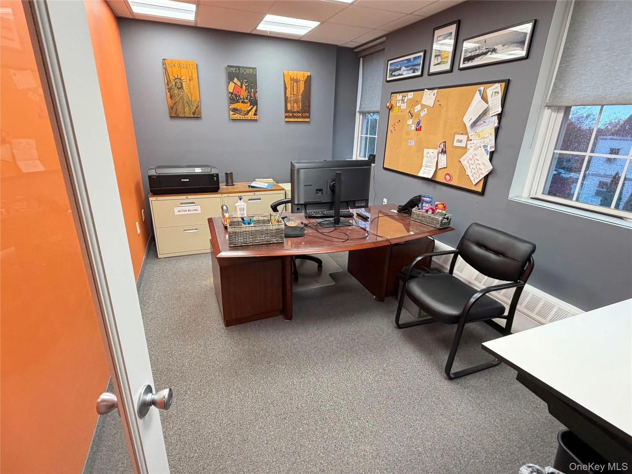 Home office featuring a drop ceiling Home office featuring a drop ceiling