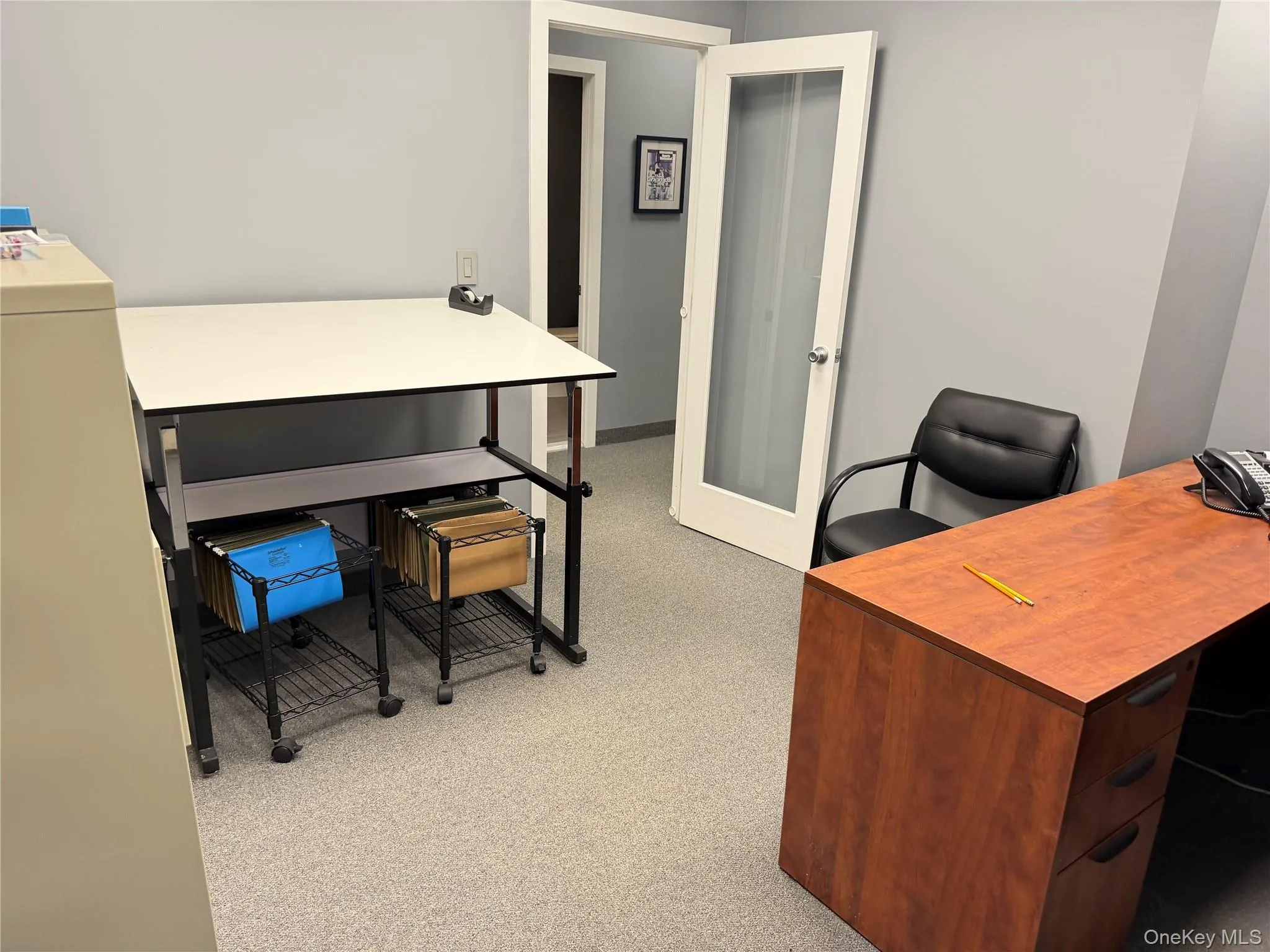 Office featuring light colored carpet and french doors Office featuring light colored carpet and french doors