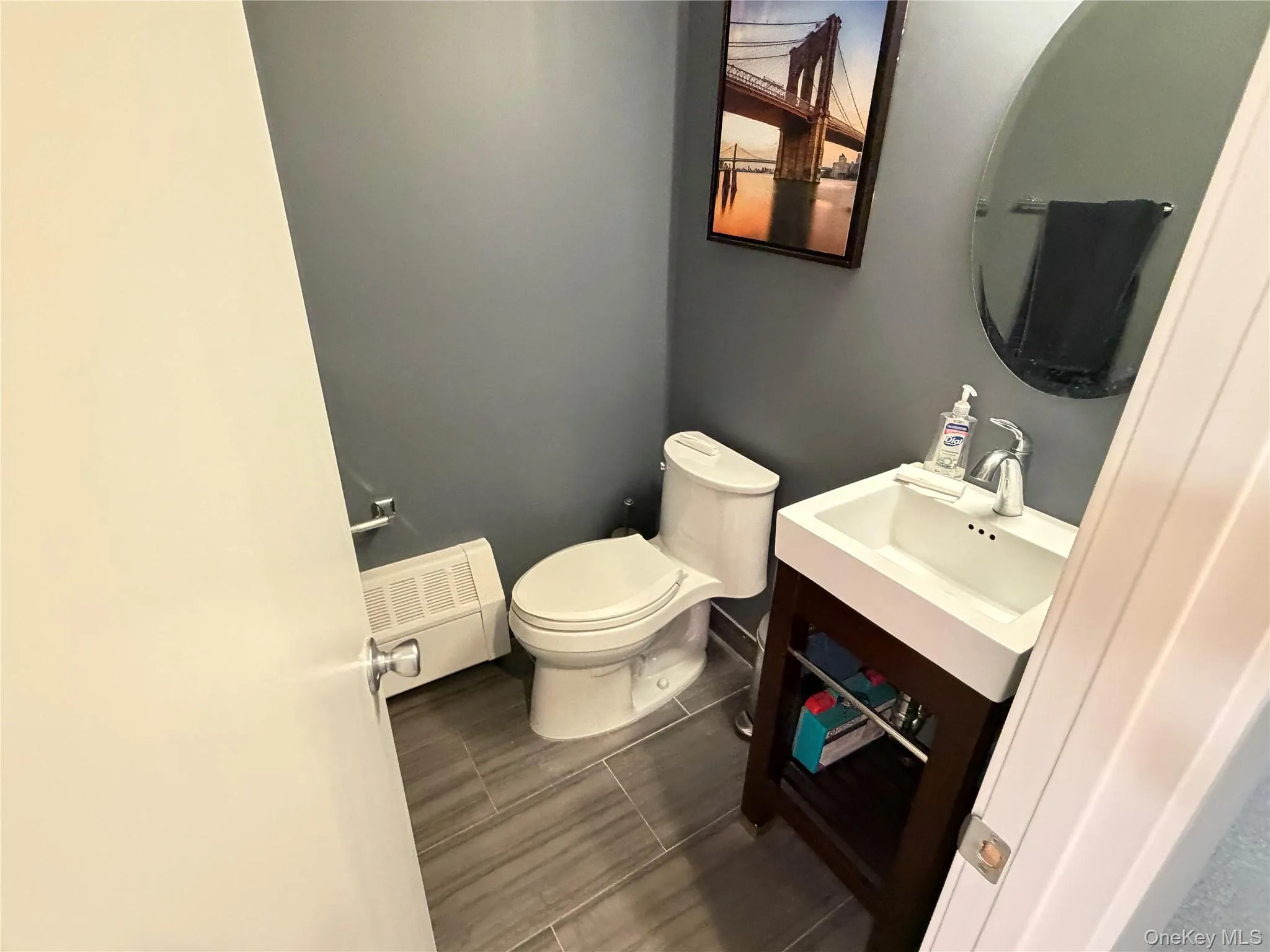 Bathroom featuring vanity and toilet Bathroom featuring vanity and toilet