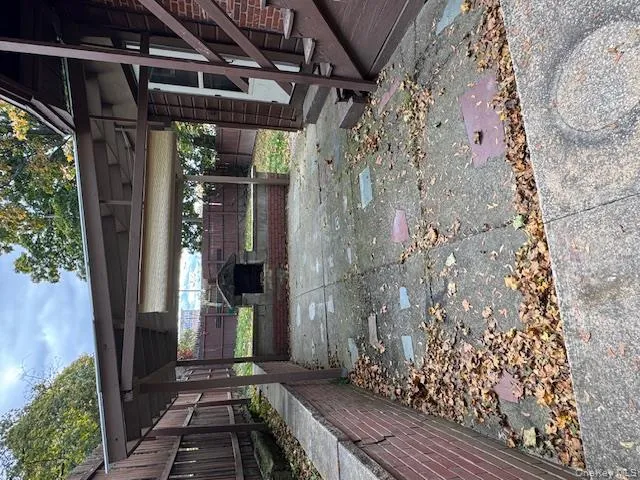 Fenced backyard with a carport Fenced backyard with a carport