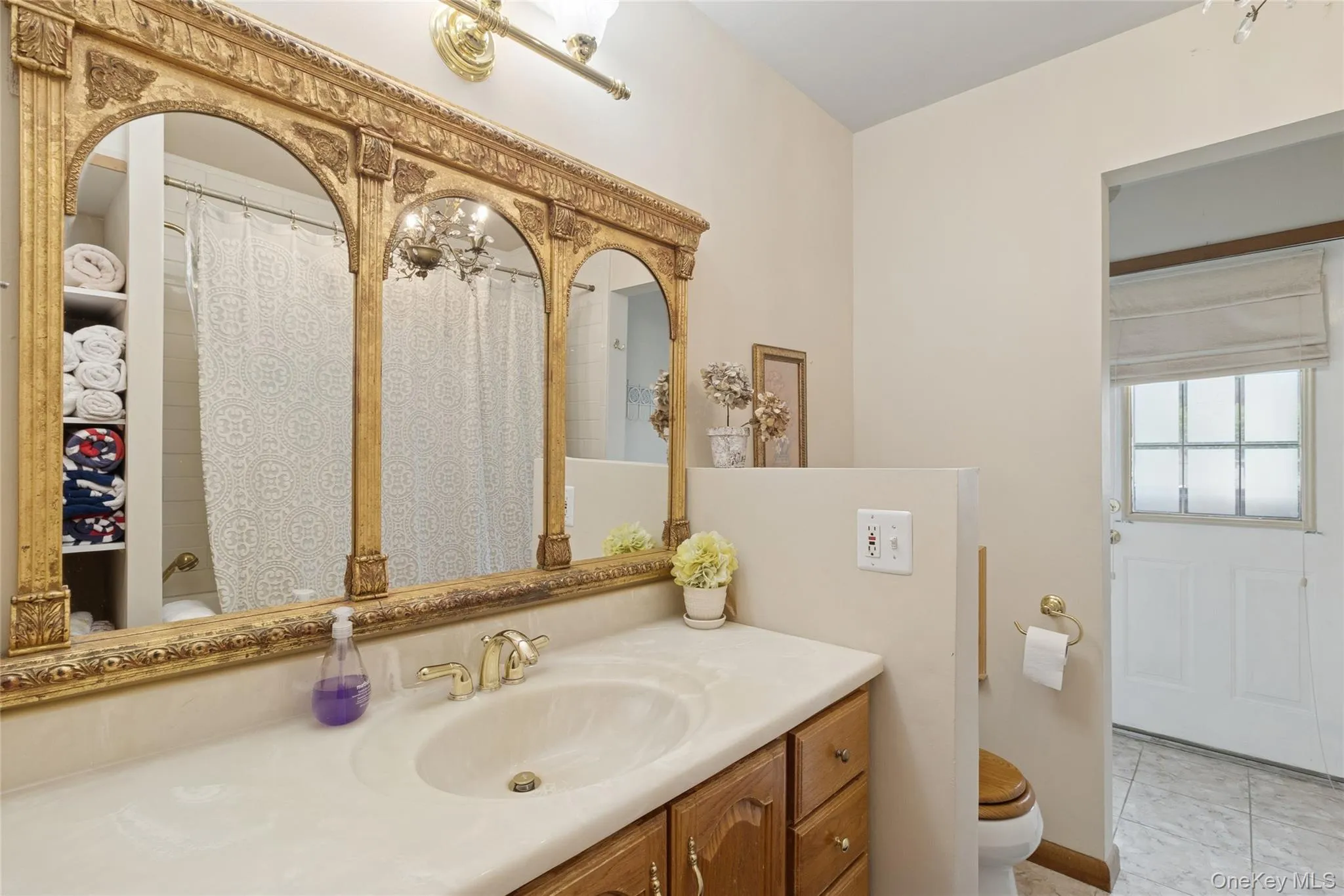 Bathroom featuring toilet and vanity Bathroom featuring toilet and vanity