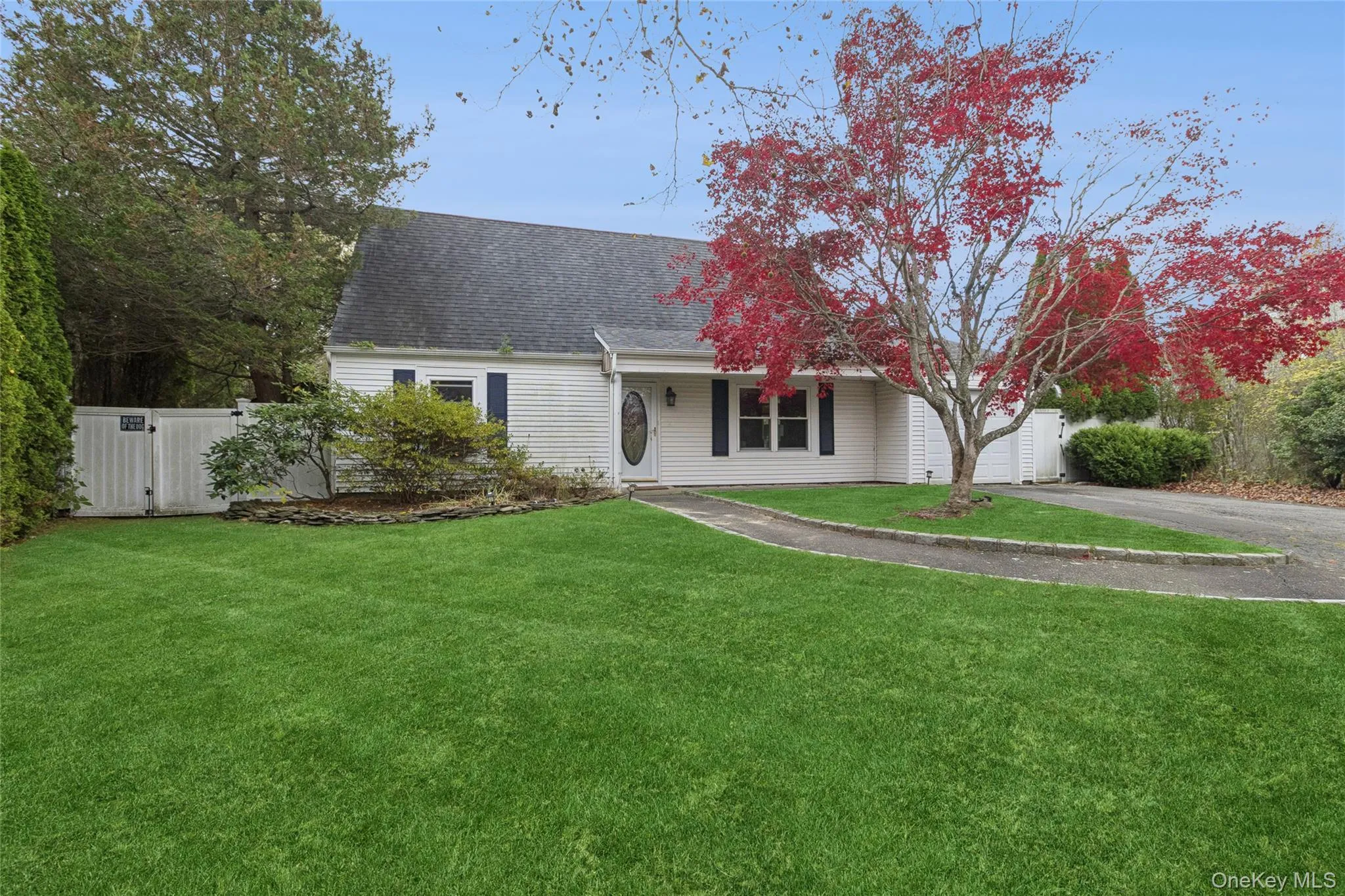 View of front of home with asphalt driveway, roof with shingles, and covered porch View of front of home with asphalt driveway, roof with shingles, and covered porch