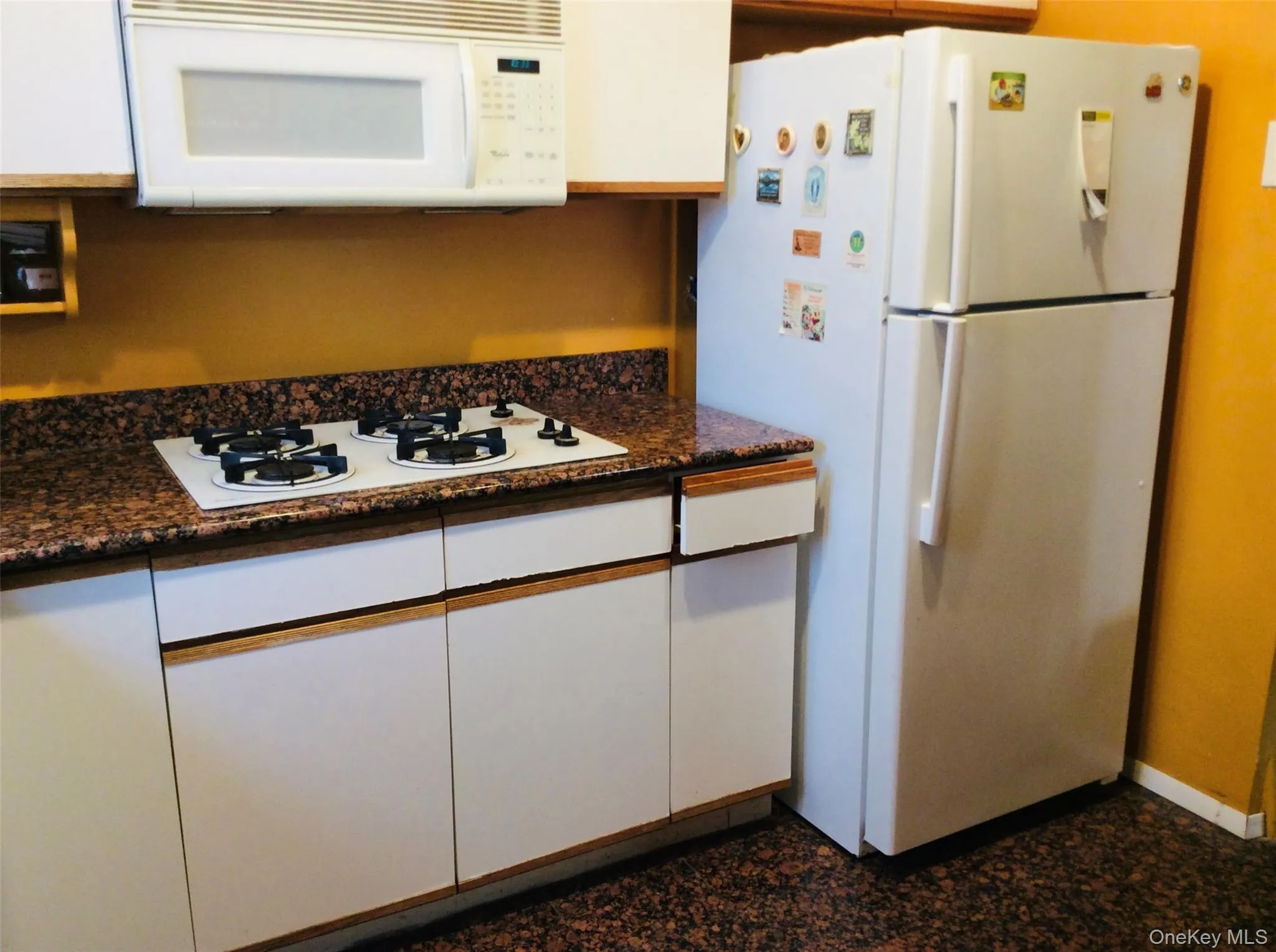 Kitchen with white cabinets and white appliances Kitchen with white cabinets and white appliances