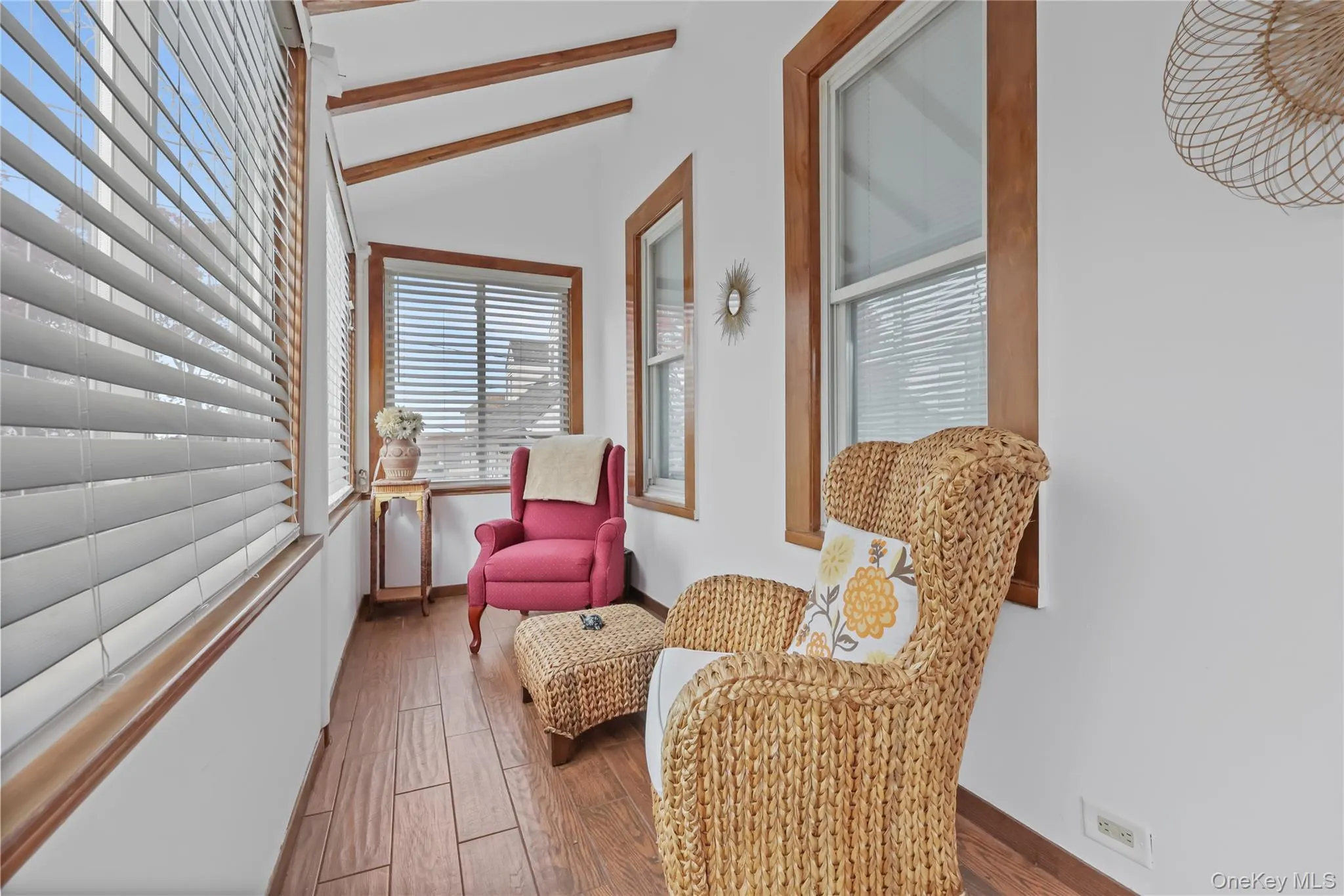 Sitting room featuring wood finished floors and baseboards Sitting room featuring wood finished floors and baseboards