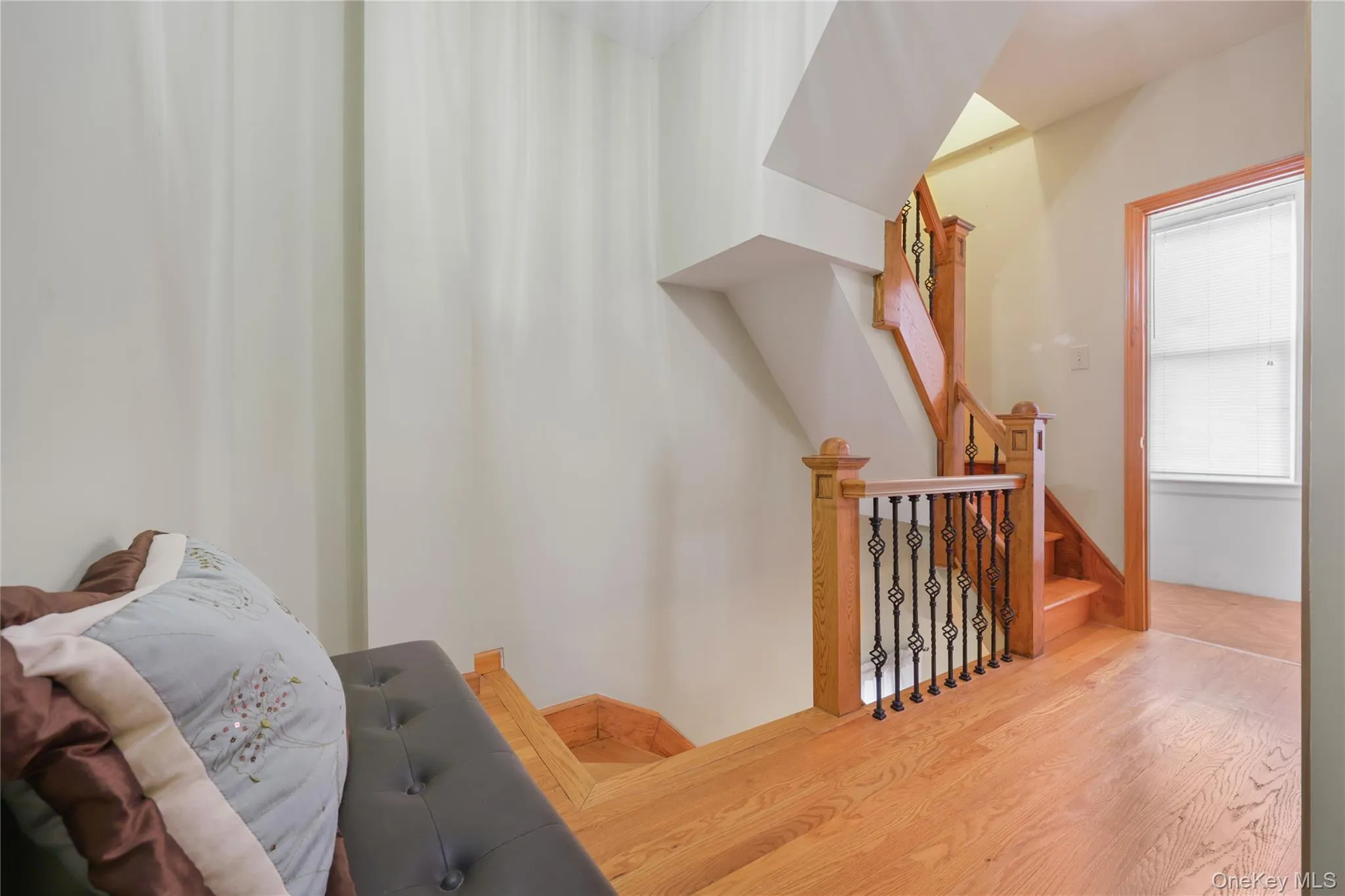 Stairway featuring wood finished floors Stairway featuring wood finished floors