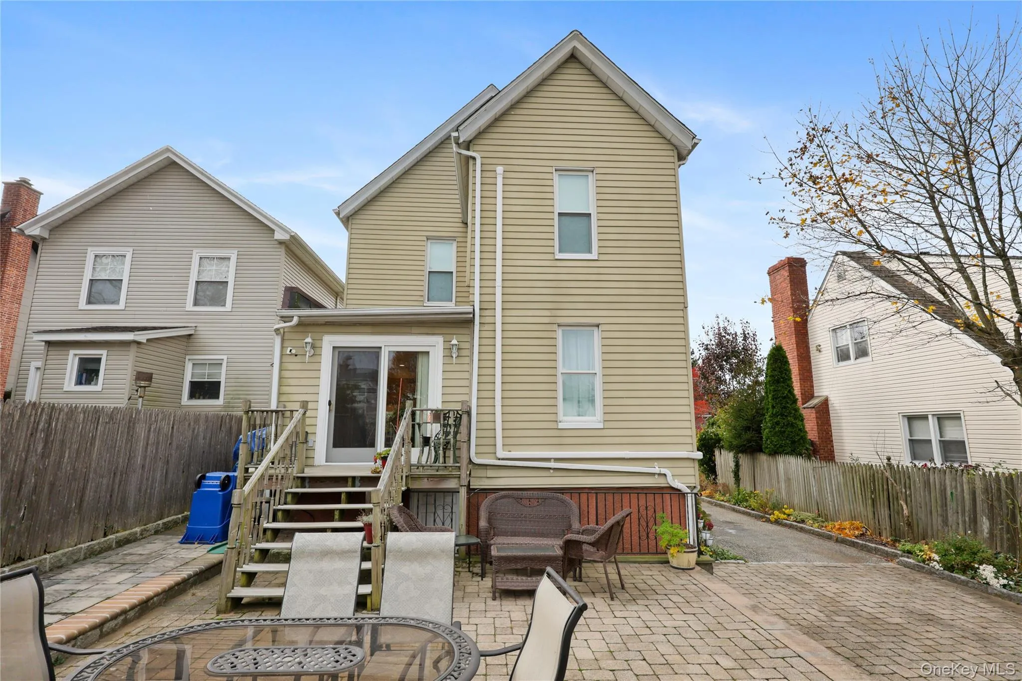 Rear view of house featuring a patio and a fenced backyard Rear view of house featuring a patio and a fenced backyard