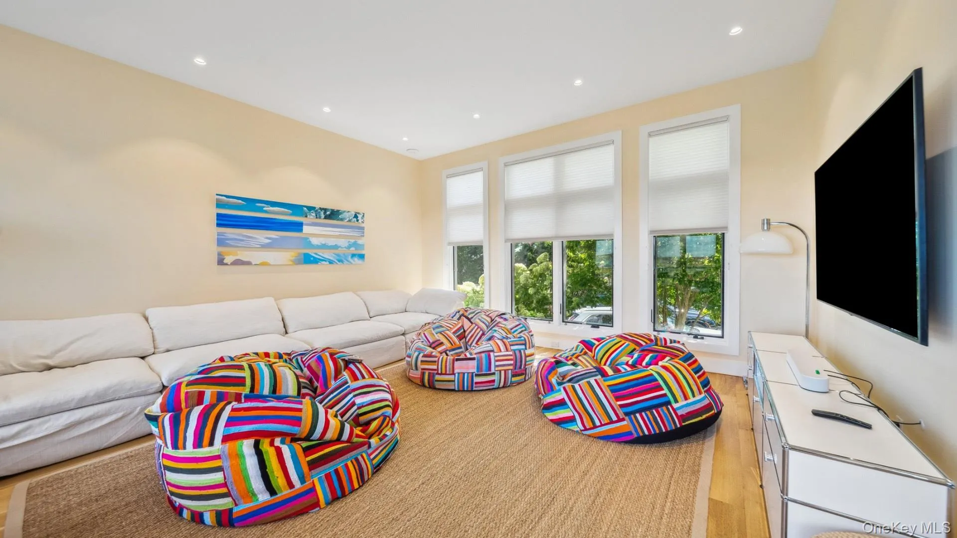 Living room with recessed lighting and light wood finished floors Living room with recessed lighting and light wood finished floors